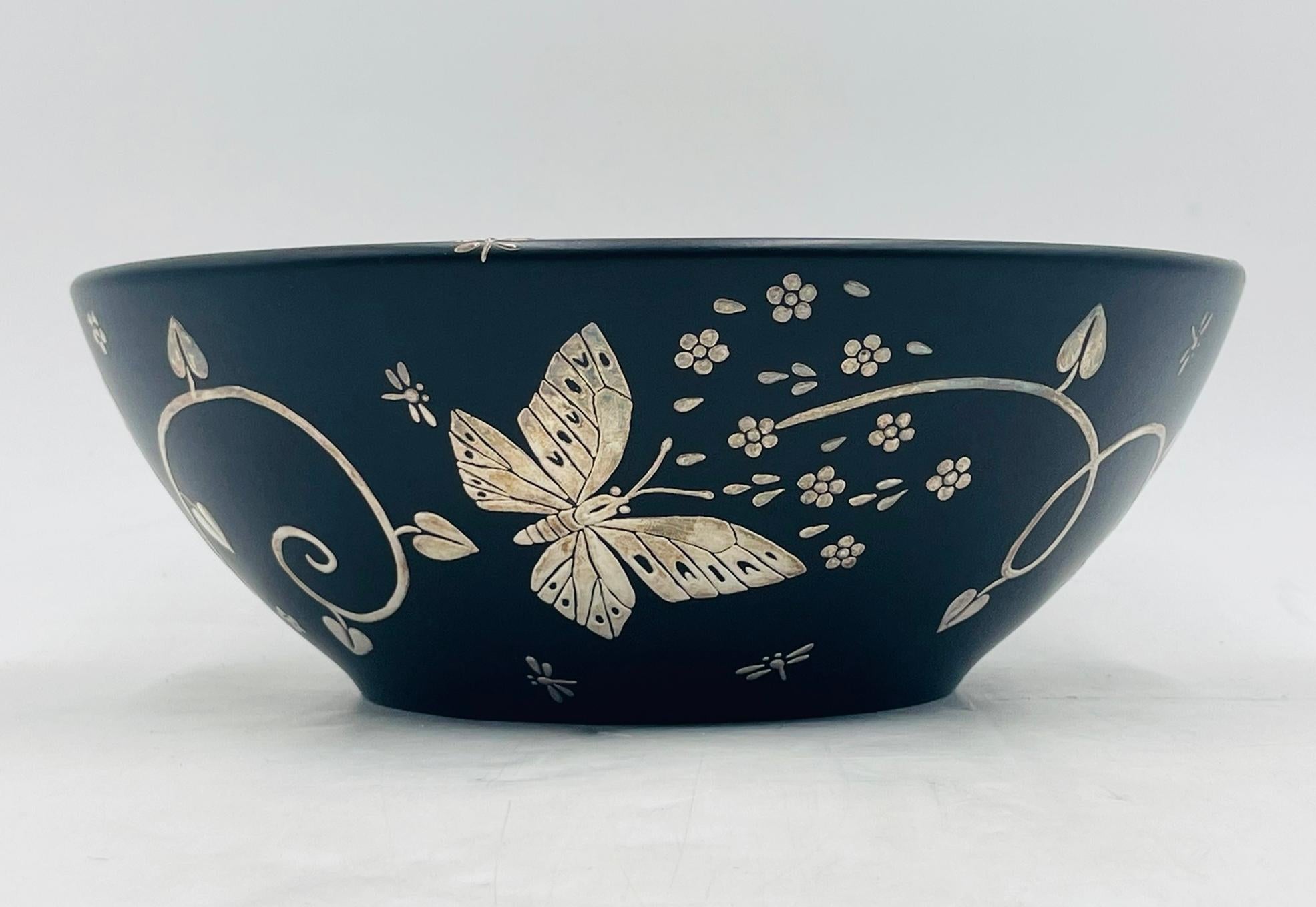 Stunning black porcelain bowl with pure silver inlay by Emilia Castillo (b. 1956), signed Emilia Castillo, Plata Pura, Mexico, W. Measuring 9.5 inches in diameter × 3.5 inches high, this exquisite decorative piece showcases butterflies and floral