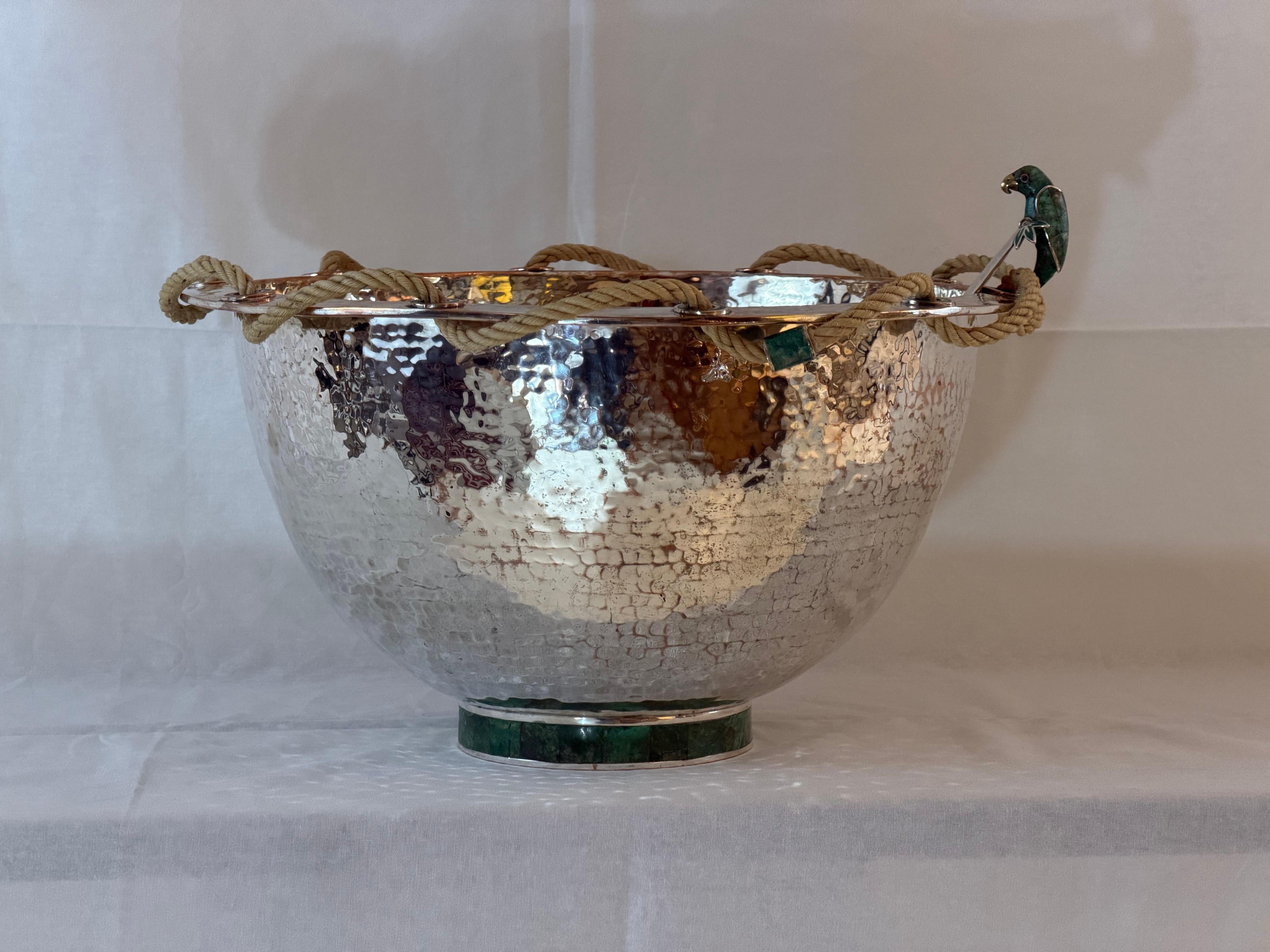 A remarkable hand-hammered silver-plated copper bowl by Emilia Castillo, showcasing the celebrated Mexican artisan’s signature fusion of silver, copper, and semiprecious stone. This exceptional piece features a rope-wrapped rim threaded through
