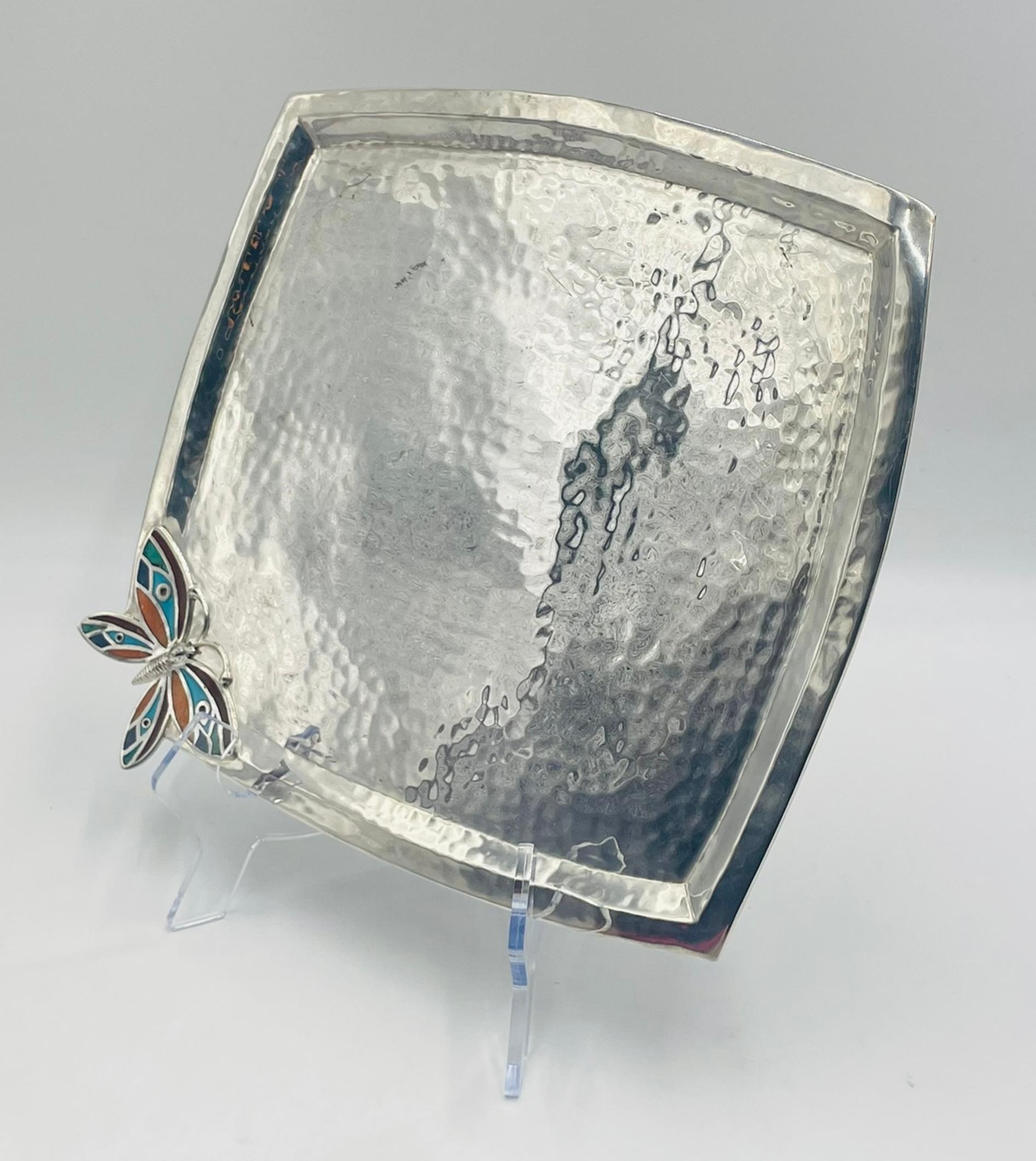 A beautifully handcrafted silver-plated serving tray designed and manufactured in Taxco, Guerrero, Mexico by acclaimed silversmith Emilia Castillo. This sculptural tray showcases Castillo’s signature blend of organic motifs and fine metalwork,