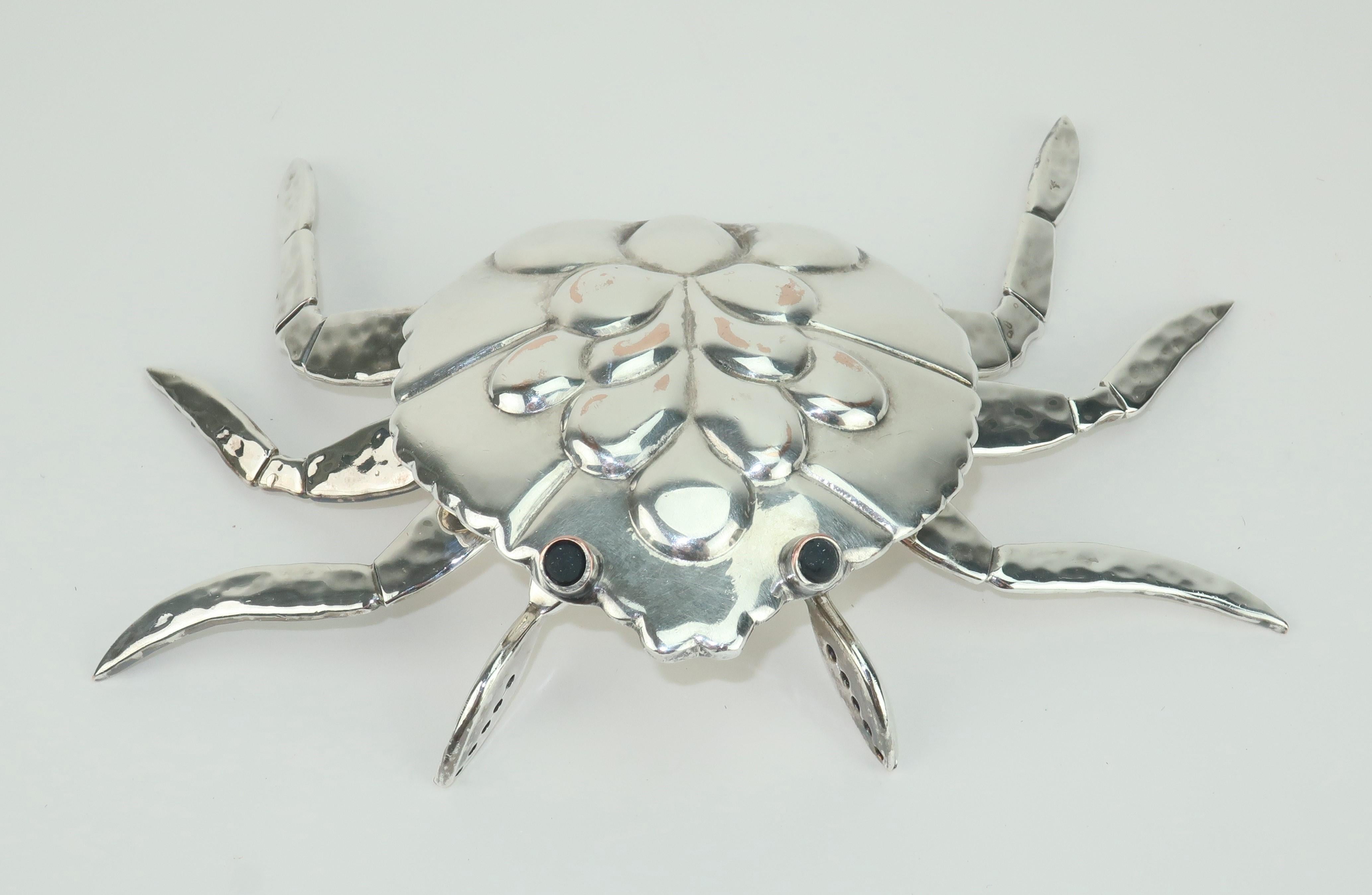 Silverplate crab bottle opener by Mexican designer, Emilia Castillo, who comes from a long line of Taxco artisans specializing in spectacular metal works. This charming crab is detailed with articulated limbs and ebony bulging eyes. As functional as