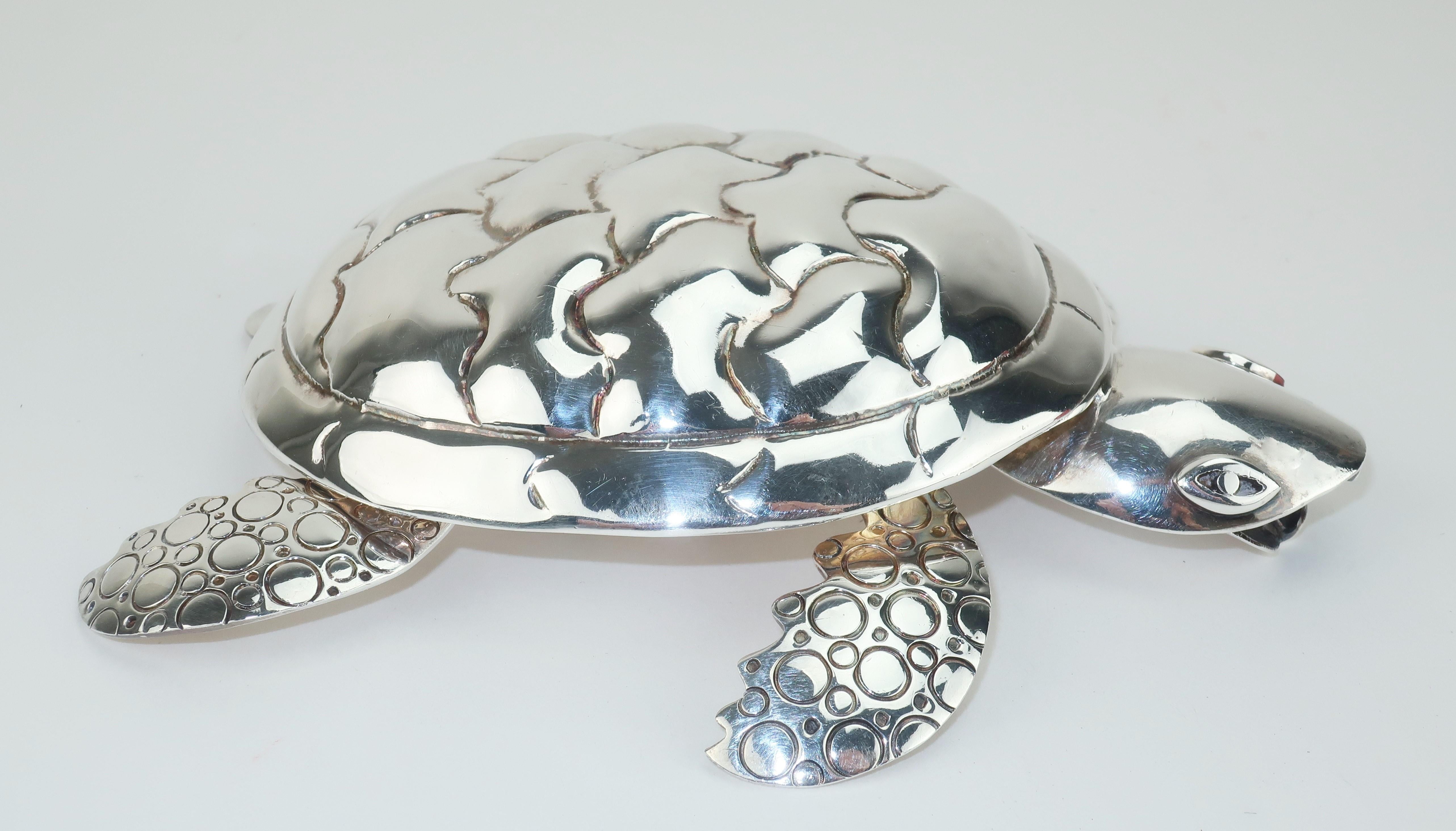 Silverplate turtle bottle opener by Mexican designer, Emilia Castillo, who comes from a long line of Taxco artisans specializing in spectacular metal works. This charming sea turtle is detailed with articulated limbs and tail. As functional as he is