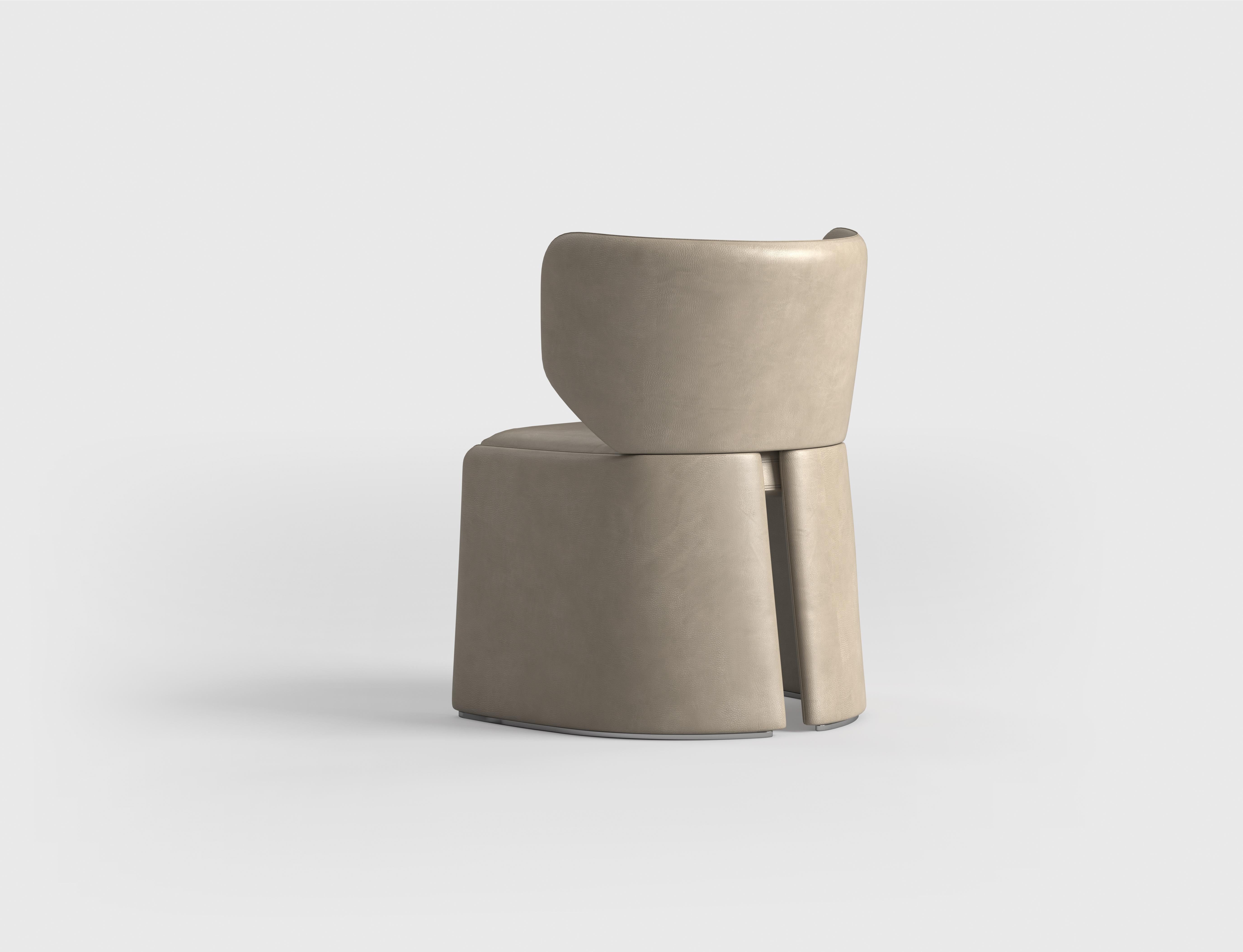 A dining chair with a structure composed of two half-moon shapes offers  unique and elegant design. The curved frame provides both aesthetic appeal and structural support, creating a harmonious balance between form and function. The seat and