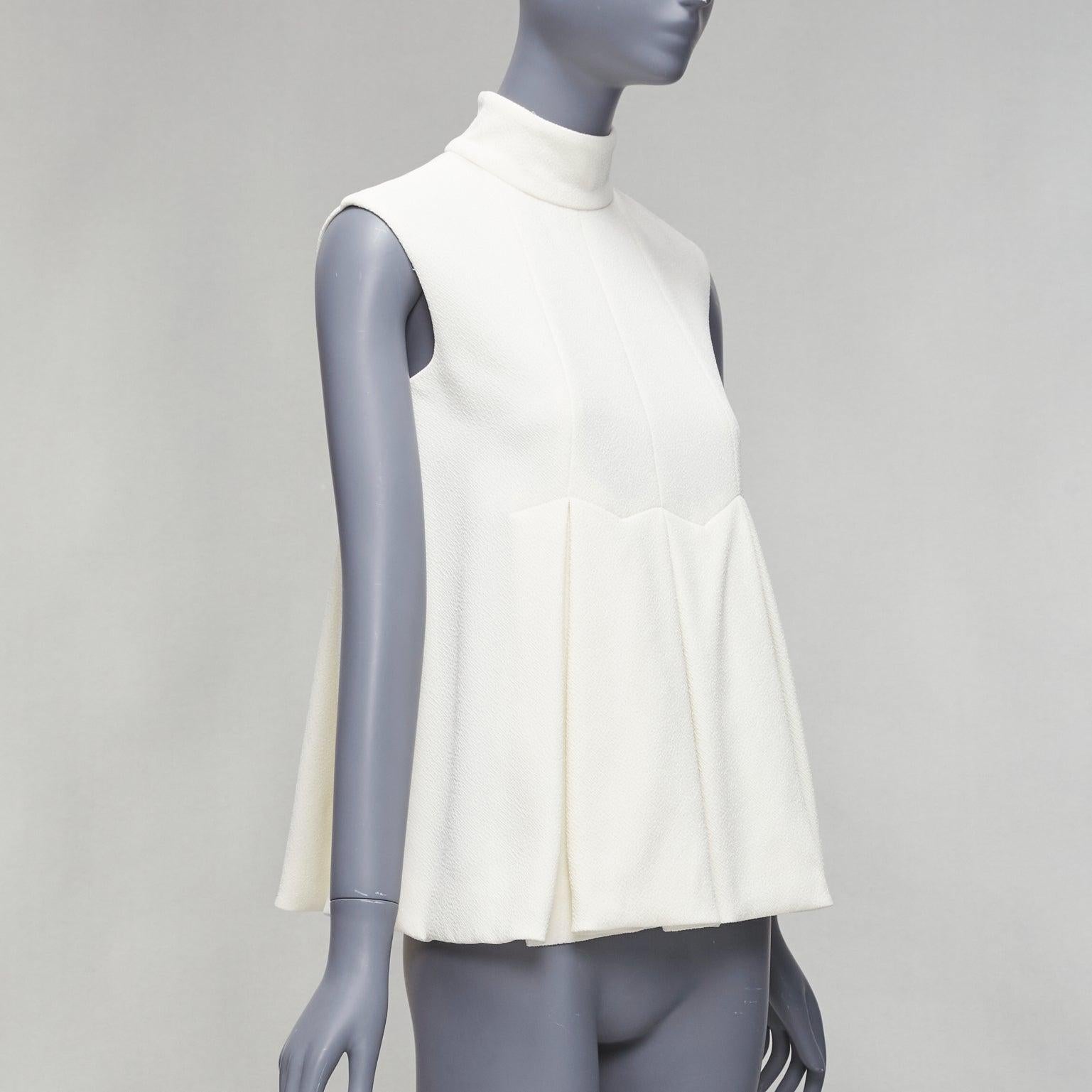 EMILIA WICKSTEAD cream crepe pleated front panel hi neck peplum top UK6 XS
Reference: LNKO/A02352
Brand: Emilia Wickstead
Material: Polyester, Blend
Color: Cream
Pattern: Solid
Closure: Zip
Lining: Cream Polyester
Made in: United