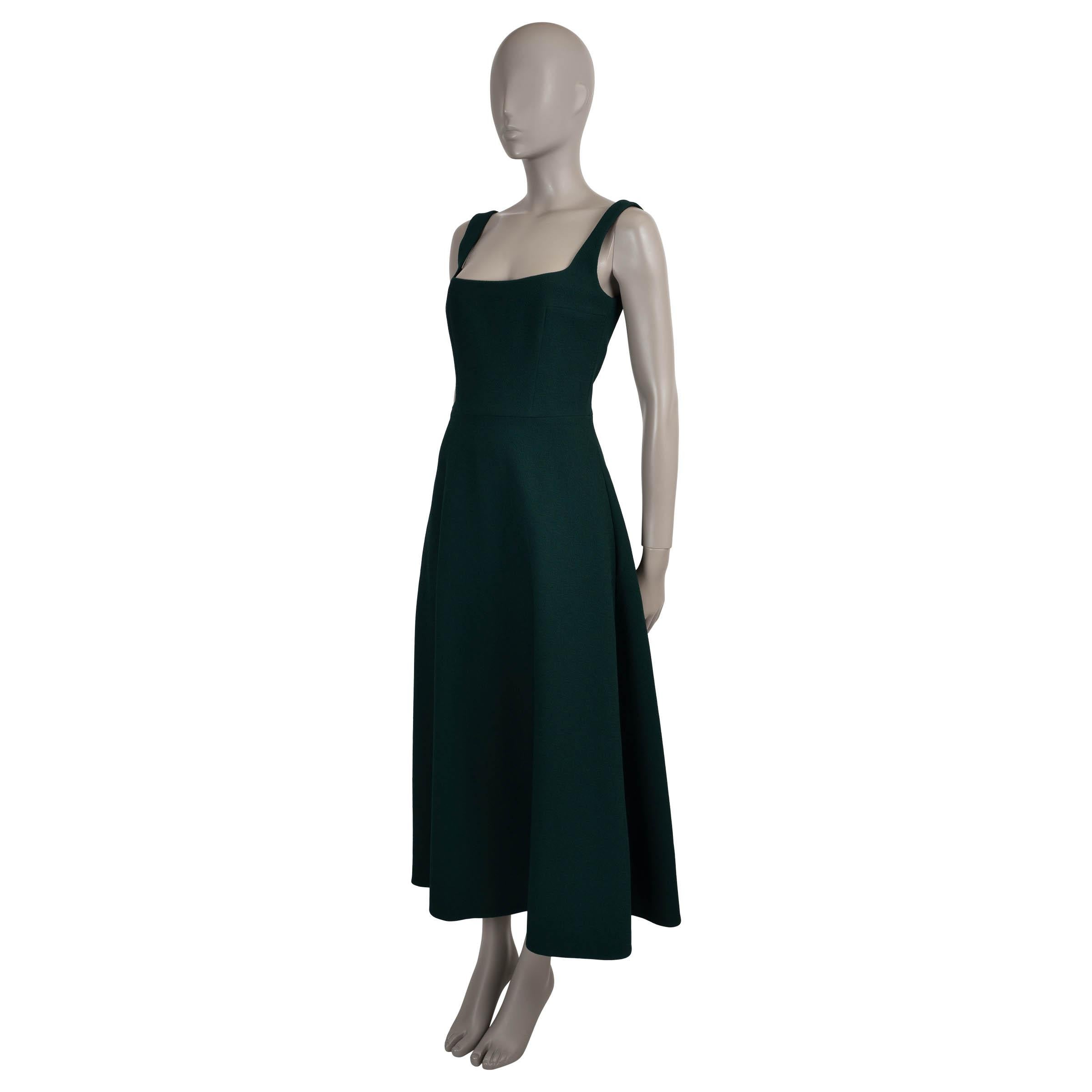 This 100% authentic Emilia Wickstead Shiloh dress is tailored in dark green crepe (95% polyester, 5% elastane). Cut in the brand’s signature fit and flare silhouette, it features a structured midi-length skirt, a square neckline, and wide shoulder