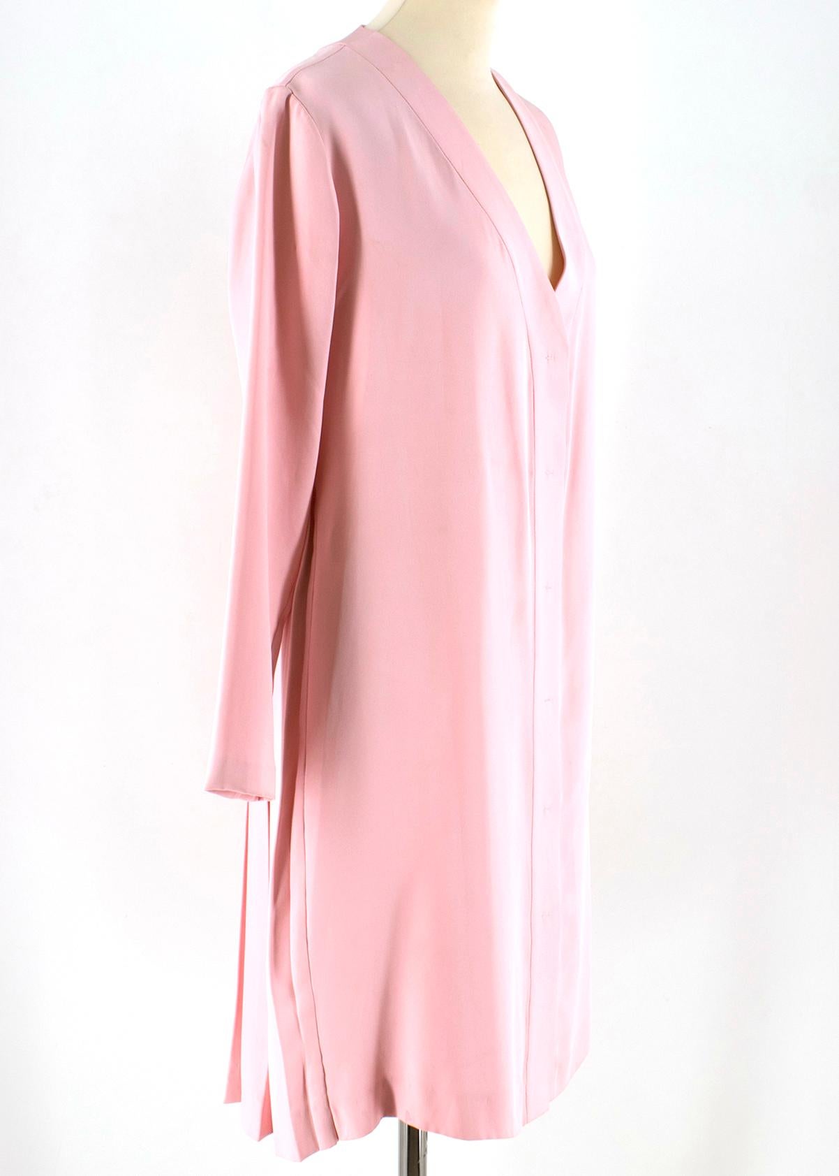 Emilia Wickstead Pink Silk Shirt Dress

- pink silk shirt dress
- ruffle bottom to the back 
- pull on 
- unlined
- relaxed fit
- v- neckline
- long sleeve

The seller usually wears XS size.

Please note, these items are pre-owned and may show some