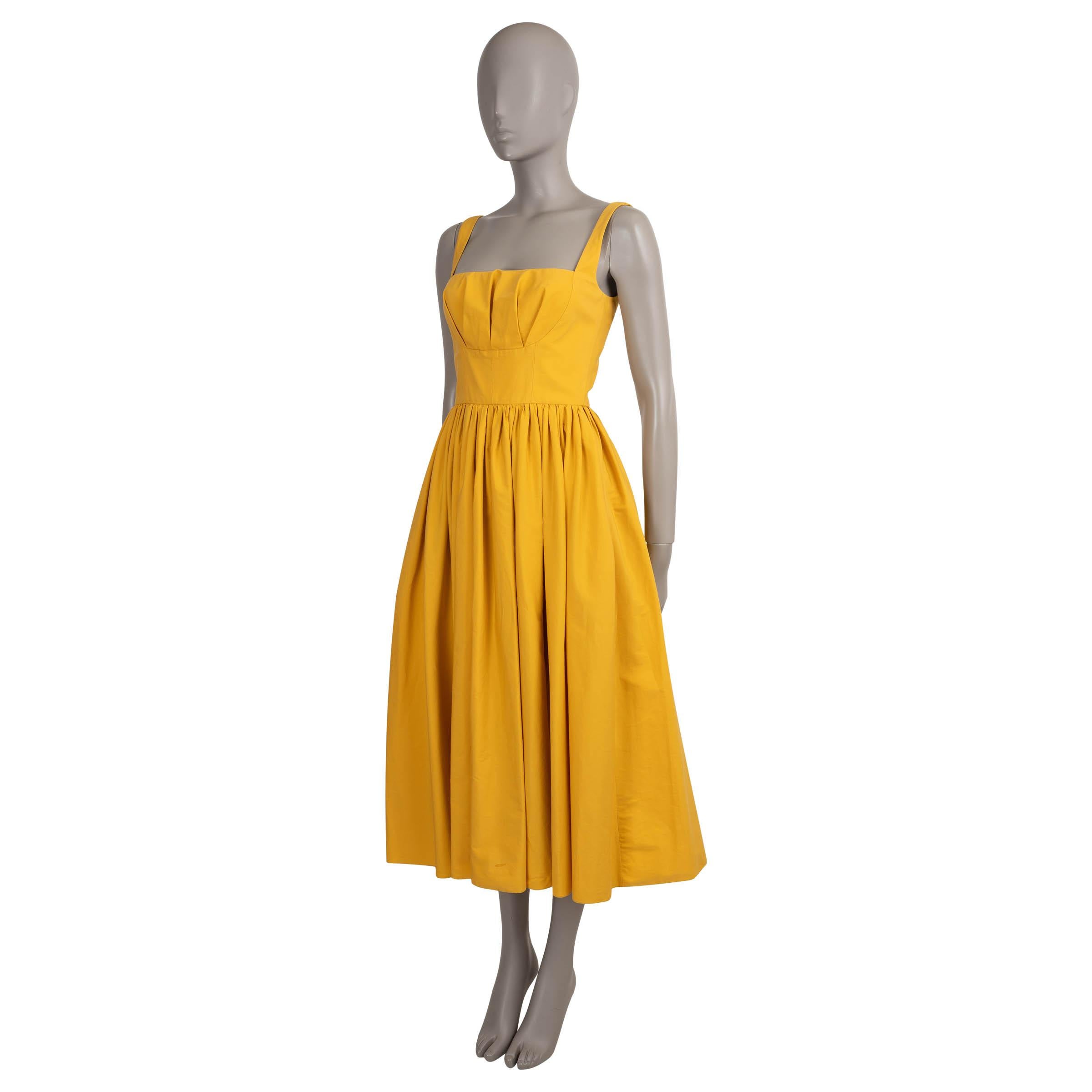 This 100% authentic Emilia Wickstead Terry dress is crafted in sunflower yellow poplin cotton (100%). Designed with a sleeveless, fit and flare silhouette, it features a pleated bust, square neckline, and a gathered midi-length skirt with side