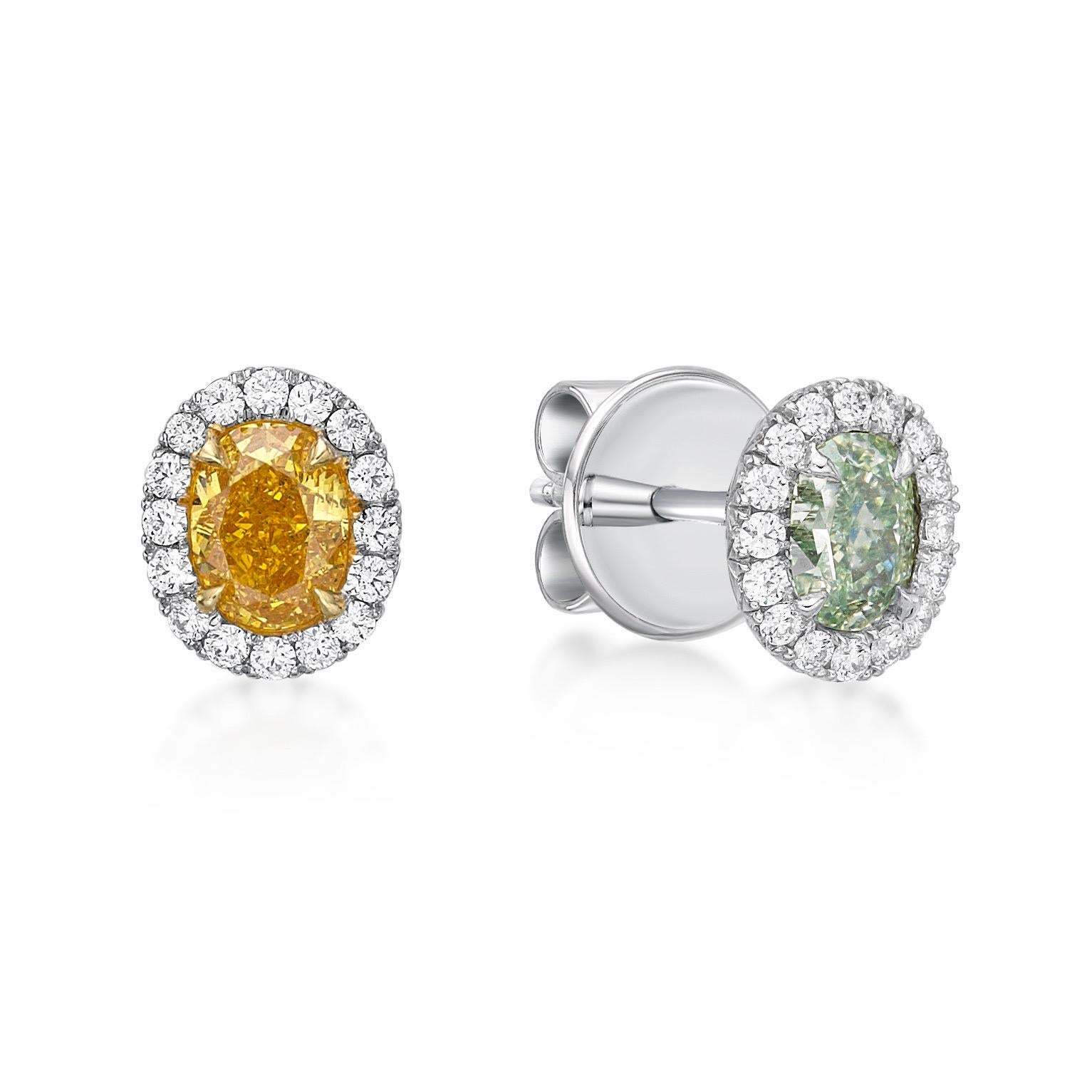 2 natural fancy diamonds featuring an orange and green diamond 0.74ct tw. 
32 small diamonds totaling .17ct 
From The Vault at Emilio Jewelry Located on New York's iconic Fifth Avenue,
Everyday but one of a kind rare studs. Total weight listed in