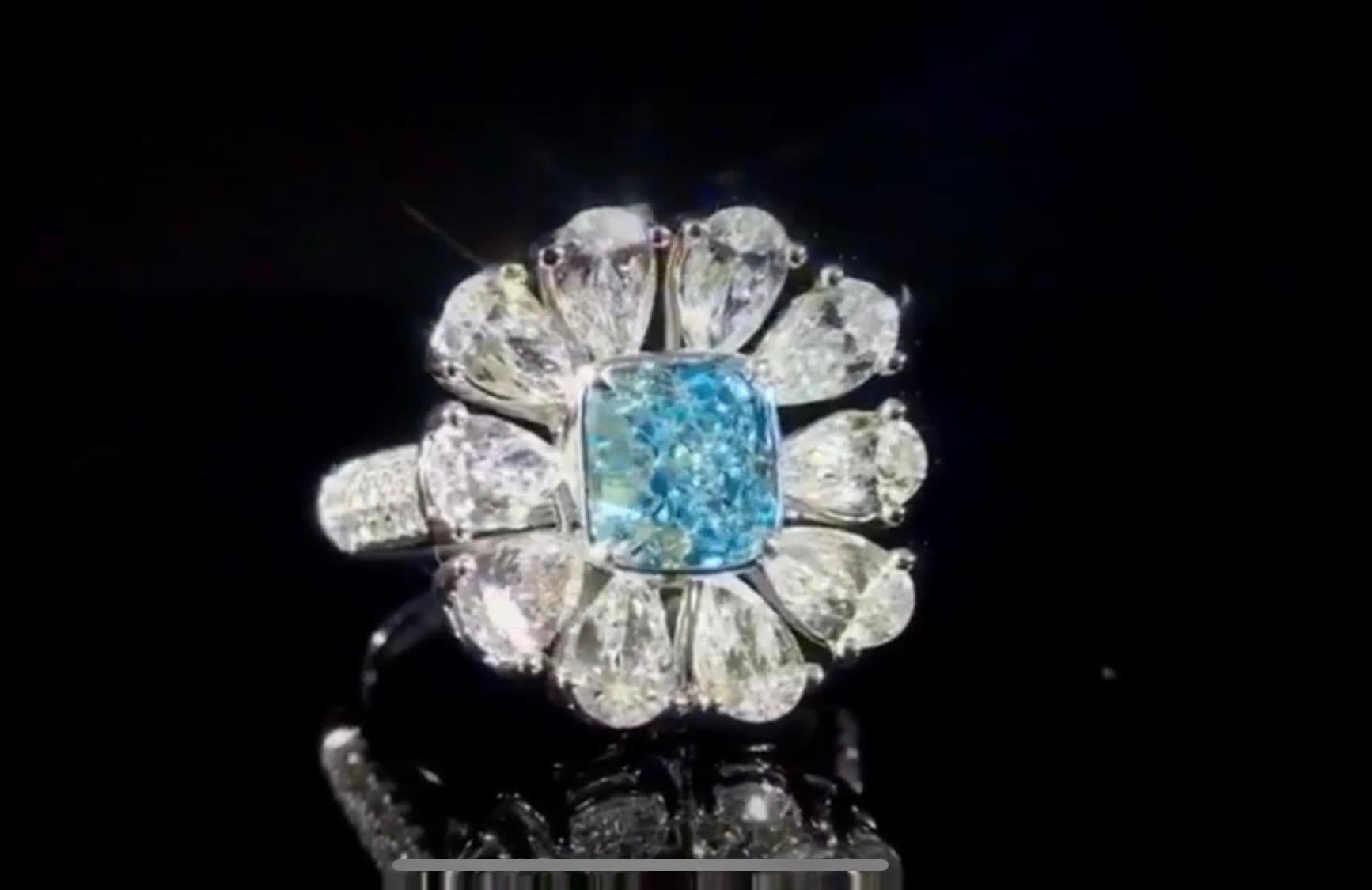 From the Emilio Jewelry Museum Vault, Showcasing a magnificent investment grade 1.00 carat Gia certified natural fancy light g. blue center stone. With Emilio's expertise after setting the center faces up with a visual of fancy intense blue! Natural