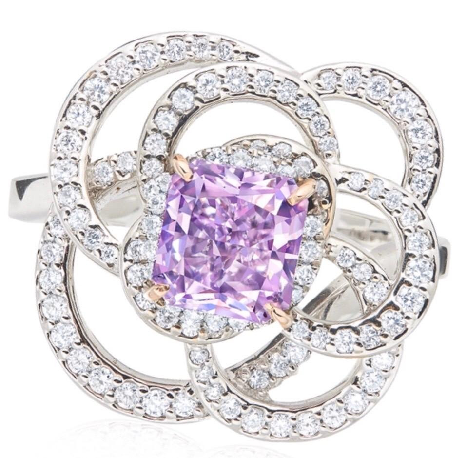 Showcasing an extremely rare 1 carat Gia certified natural fancy vivid pinkish purple diamond of exceptional quality. This piece was Hand made in the Emilio Jewelry Atelier, whom specializes in rare collectible pieces in the Fancy colored diamond,