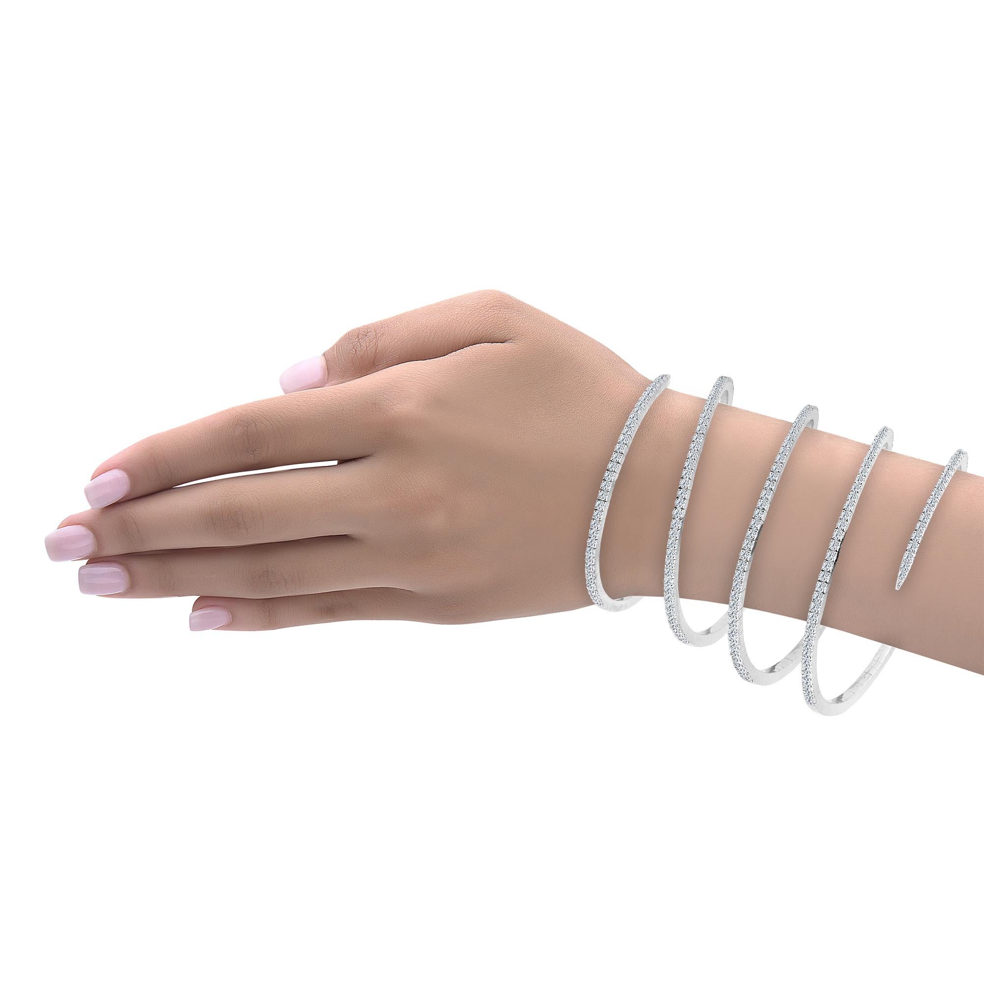 Hand made in the Emilio Jewelry Factory, this cuff is extremely flexible set in 14K white gold but can be ordered in 18K Yellow/white/Rose gold. This cuff is made with springs inside so is very durable, safe, and made to stretch! We also make this