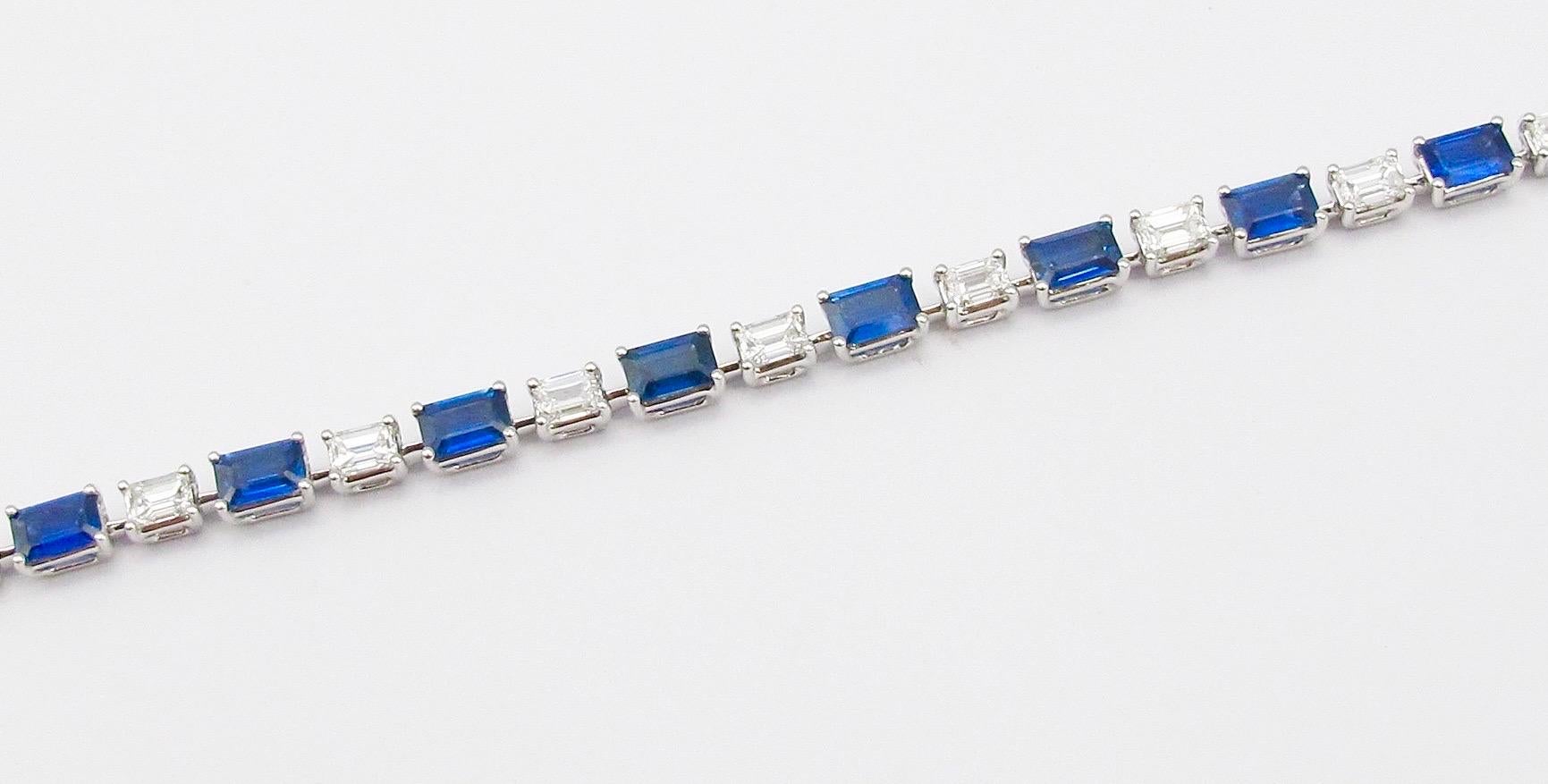 From the vault at Emilio Jewelry located on New York's iconic Fifth Avenue,
Featuring Emerald cut royal blue clean sapphires all matching, set along D-F Color Vs1-Vs2 Diamonds. 
Diamond Weight: 3.81 carats
Sapphire Weight: 7.93 carats
Please inquire