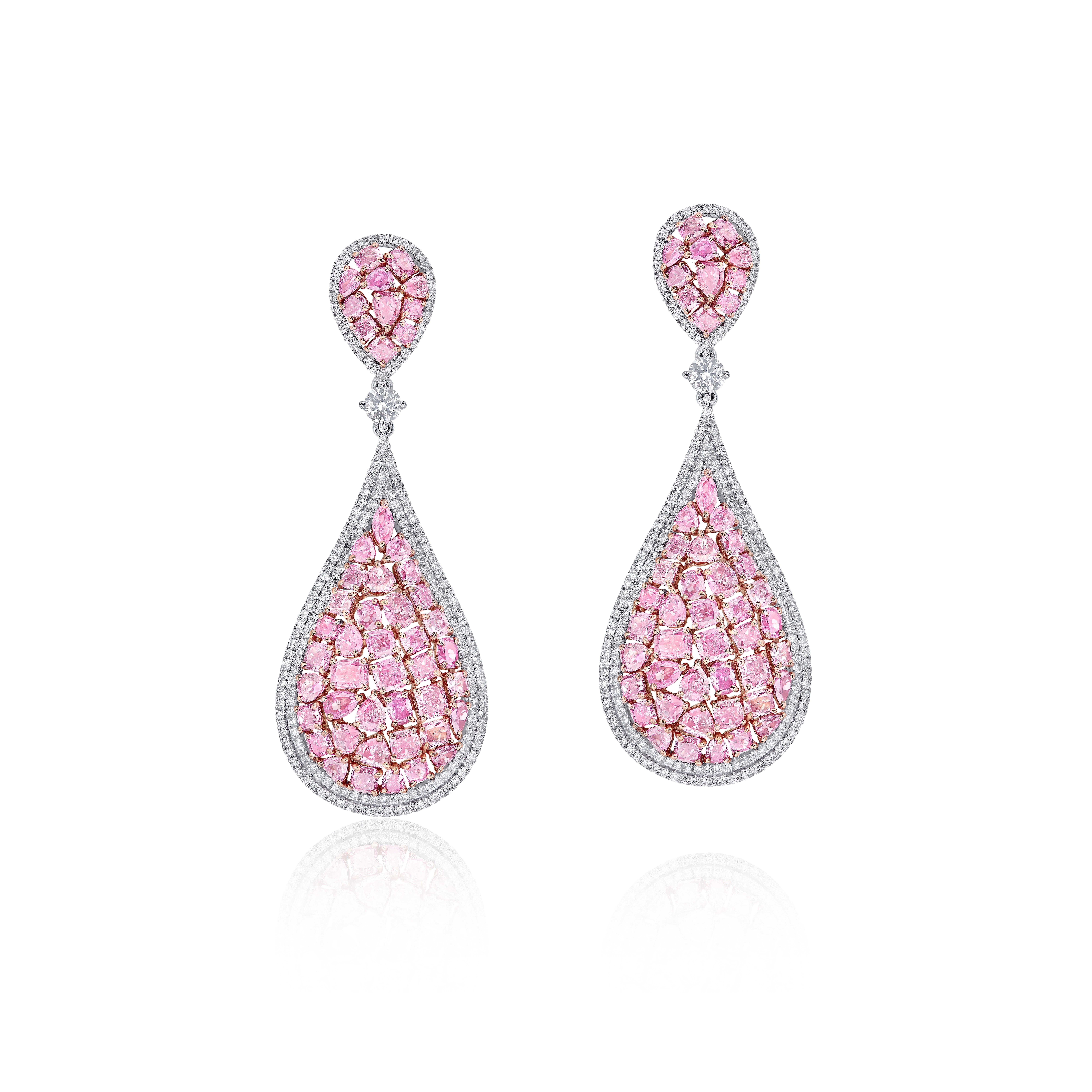 From the vault at Emilio Jewelry, located on New York's iconic Fifth Avenue,
A truly difficult piece to make, we spent over 1 year accumulating matching natural pink diamonds over different shapes, to create this one of a kind earring. 
Weight: pink