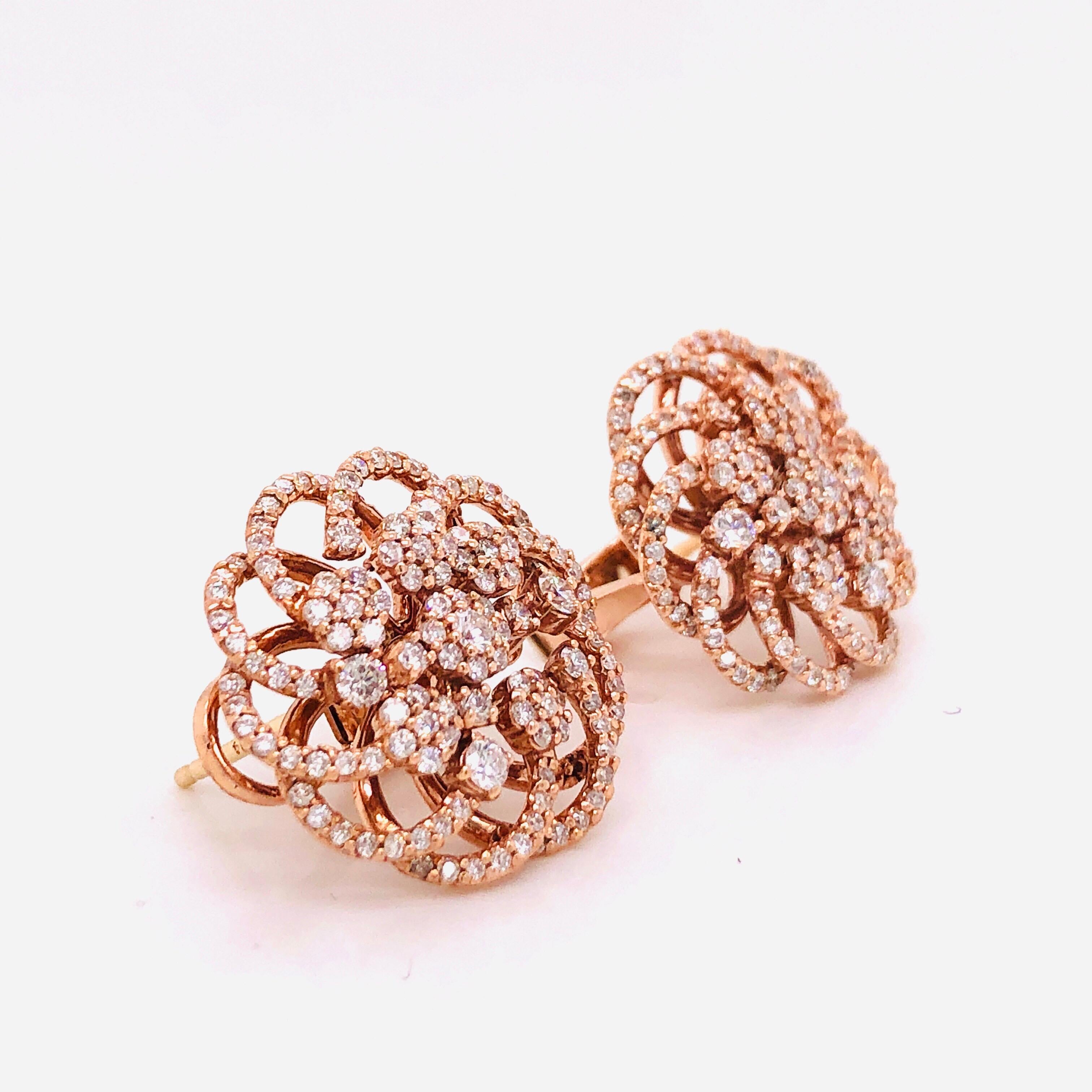 Hand made in the Emilio Jewelry factory, this pair is set in 14k rose gold with 276 round white diamonds totaling 1.89 carats. The earrings measure 19.75mm wide.
Color: F-
Clarity: Vs-Si 