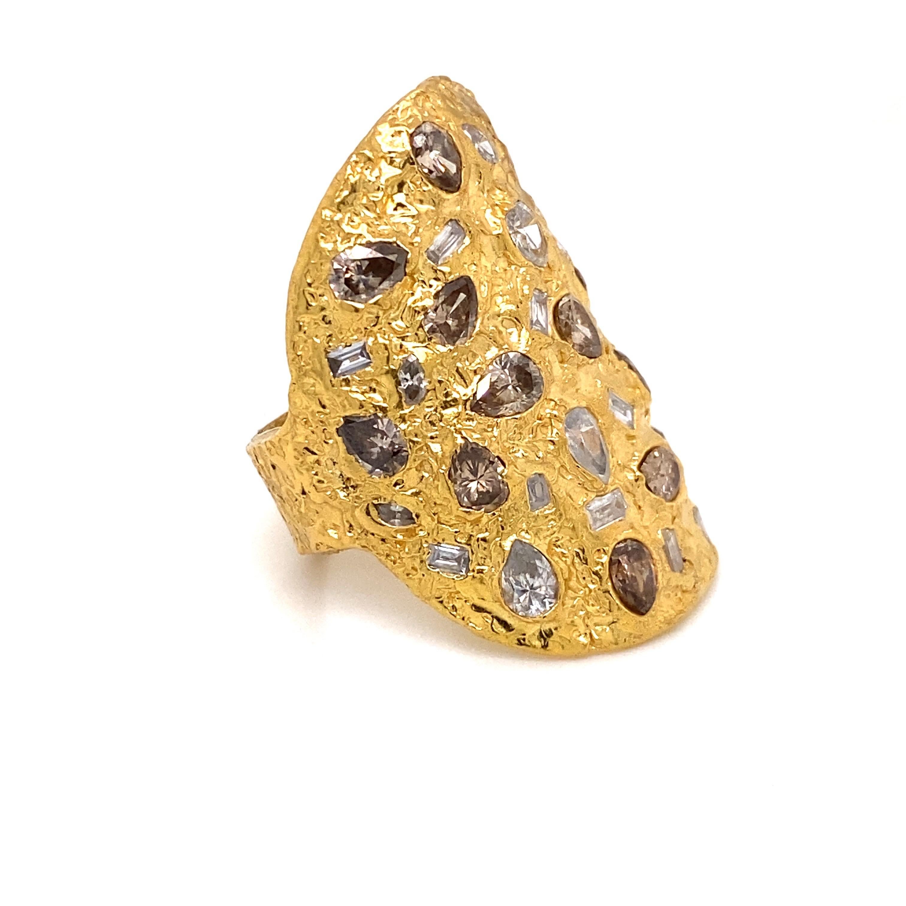 From the vault at Emilio Jewelry located on New York's iconic Fifth Avenue,
Featuring natural pear shape champagne and white diamonds vvs-vs2 clarity,  have been set in a hand made 22 Karat gold hammered ring which is bold and breathtaking!! Made to