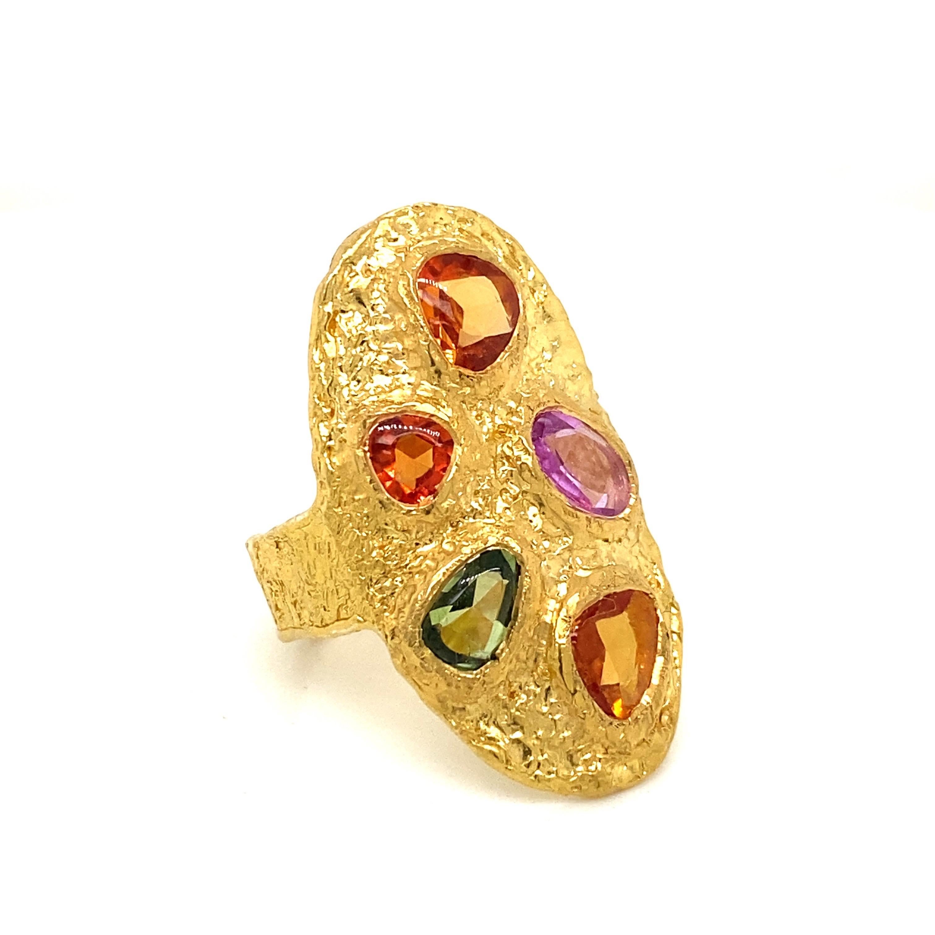 From the vault at Emilio Jewelry located on New York's iconic Fifth Avenue,
Featuring 5 ancient cut multi color sapphires, totally approximately 3.50 carats. Each stone is totally unique...gorgeous purple, orange, peach, green,blue, pink sapphires