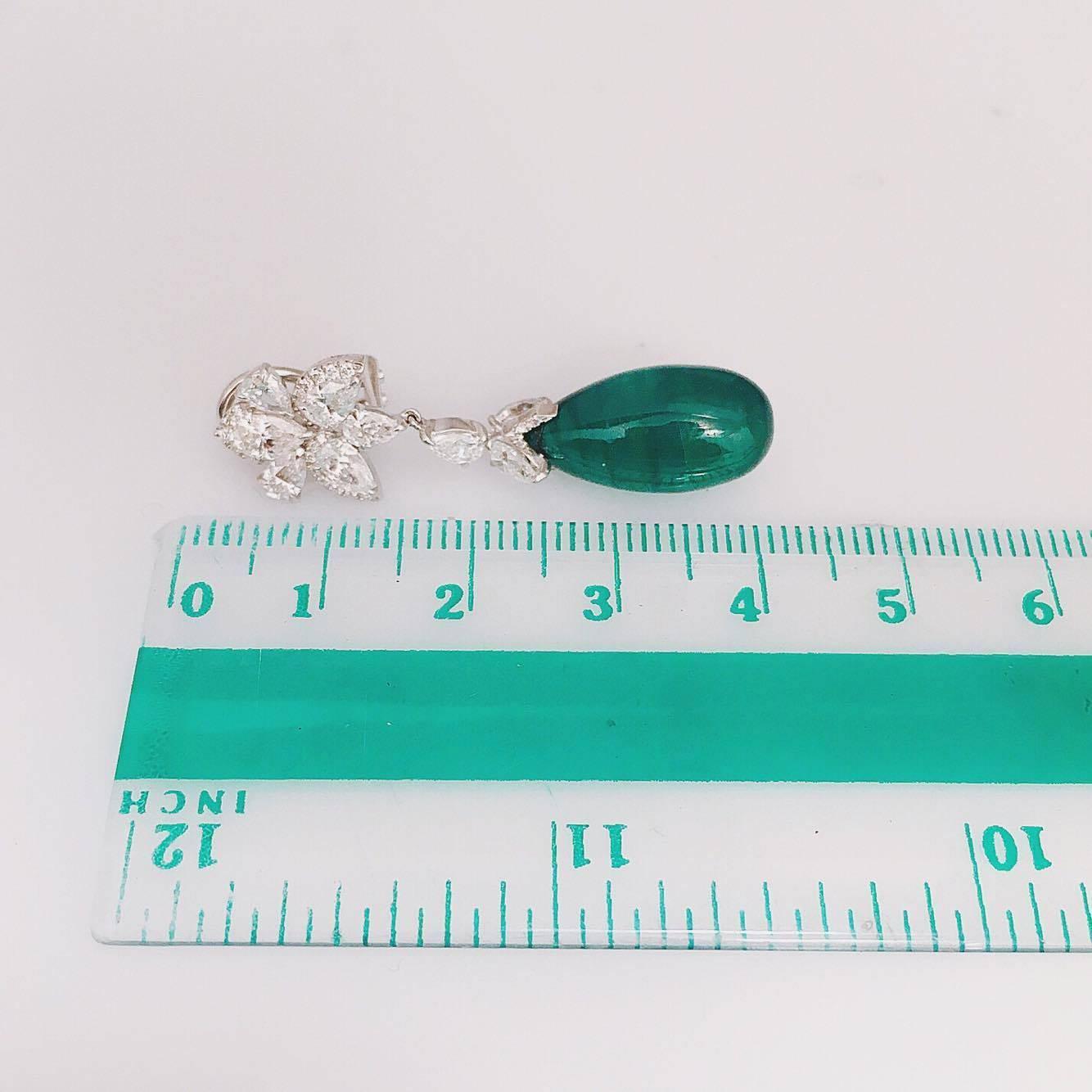 Wow! We handmade these one-of-a-kind emerald diamond earring with micro pave diamonds and pear shapes. Please inquire for certificates. The origin of the emeralds are Zambian however if you require Colombian we also have a large inventory. 
 
18kt