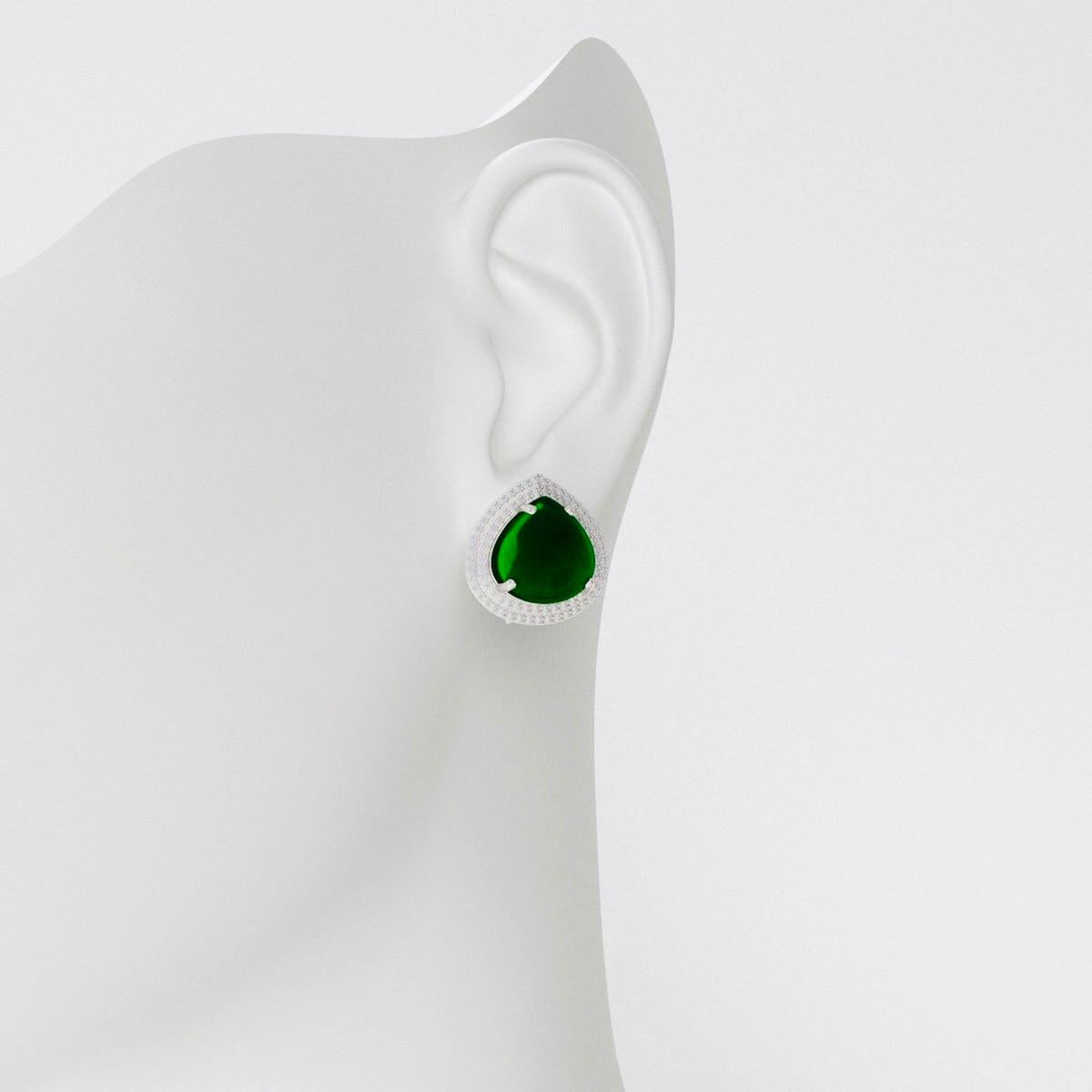 Gorgeous unique cut pear/heart  shape Cabochon Emeralds Cut specially for this design of immense rich green color and very clean plus totally eye clean. The emeralds are of Zambian origin and will be certified. 