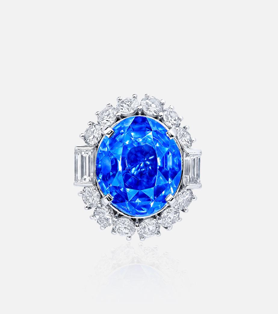 Another hand made masterpiece from the Museum Vault At Emilio Jewelry, located on New York's iconic Fifth Avenue.A rare majestic cornflower blue no heat 28 carat sapphire sits in the center. 
Please inquire for additional details, certificates,