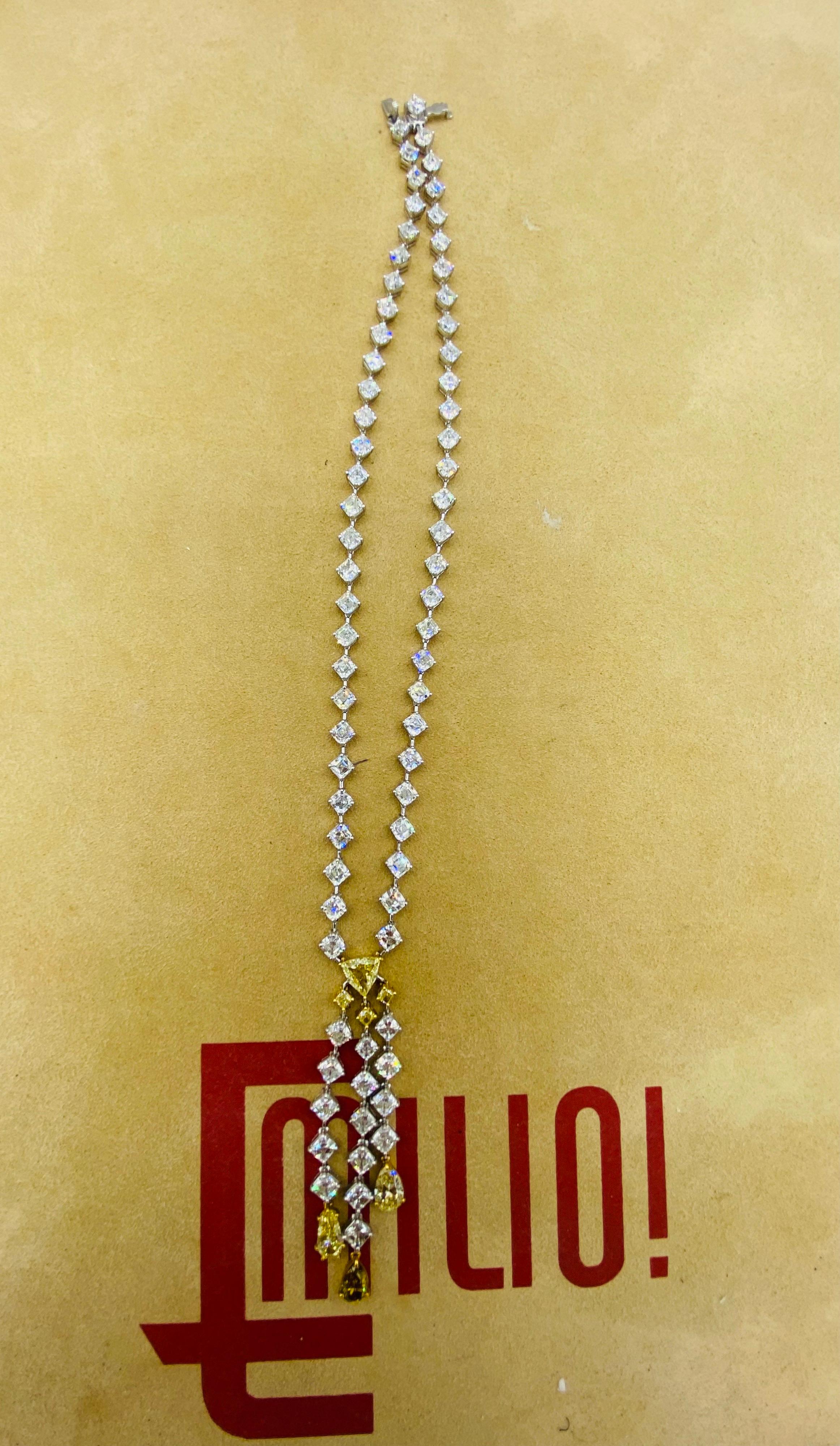 From the vault at Emilio Jewelry in New York,
a unique diamond necklaces featuring Asscher cut diamonds, 
Length: 16” 
2.75” lariet hanging 
diamond details:
1 Gia certified Fancy intense yellow diamond 1.06cts
1 Gia certified pear shape fancy deep