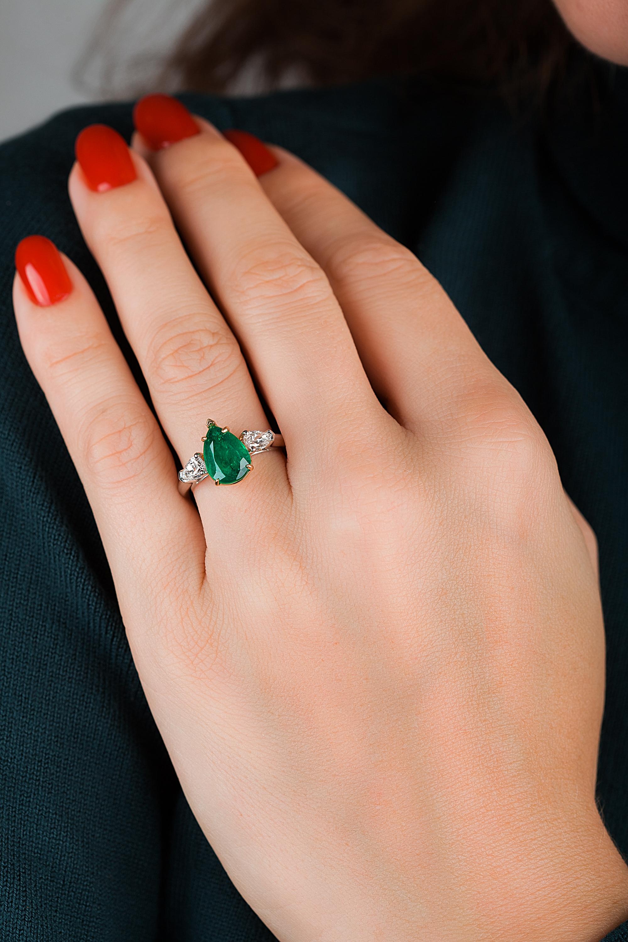 Showcasing a pear shape 2.42ct Genuine Emerald certified by C.Dunaigre as Zambian origin. The color has been certified as Vivid green, the most desirable color in emeralds. Based on emerald grading methodology the clarity of the emerald is
