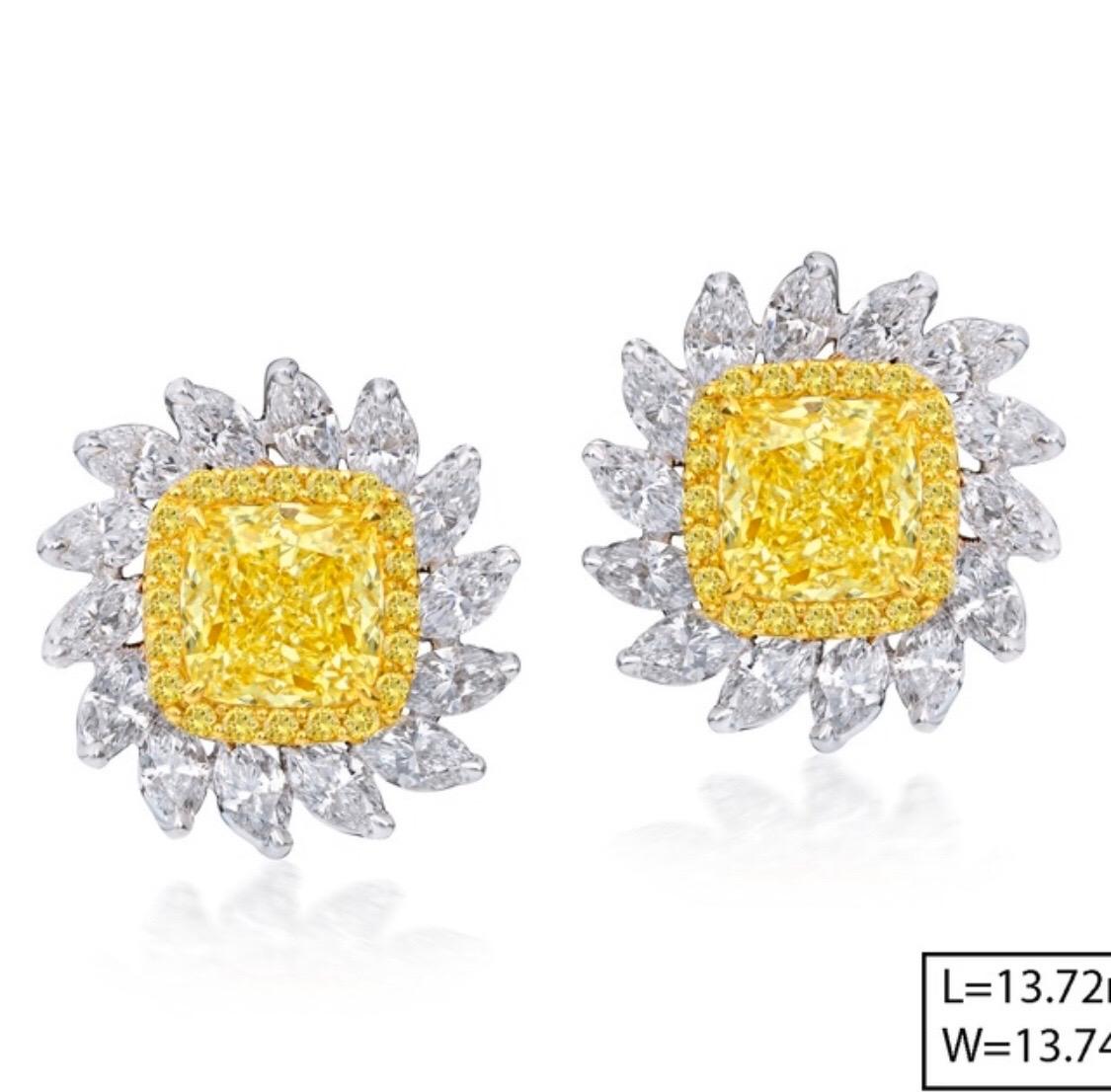 Showcasing 
2 cushion yellow diamonds=2.02ct
28 marquise=1.46ct
40 rounds=.18ct
. Hand made in the Emilio Jewelry Atelier, whom specializes in rare collectible pieces in the Natural ultra rare fancy colored Diamond sector.
Please inquire for more