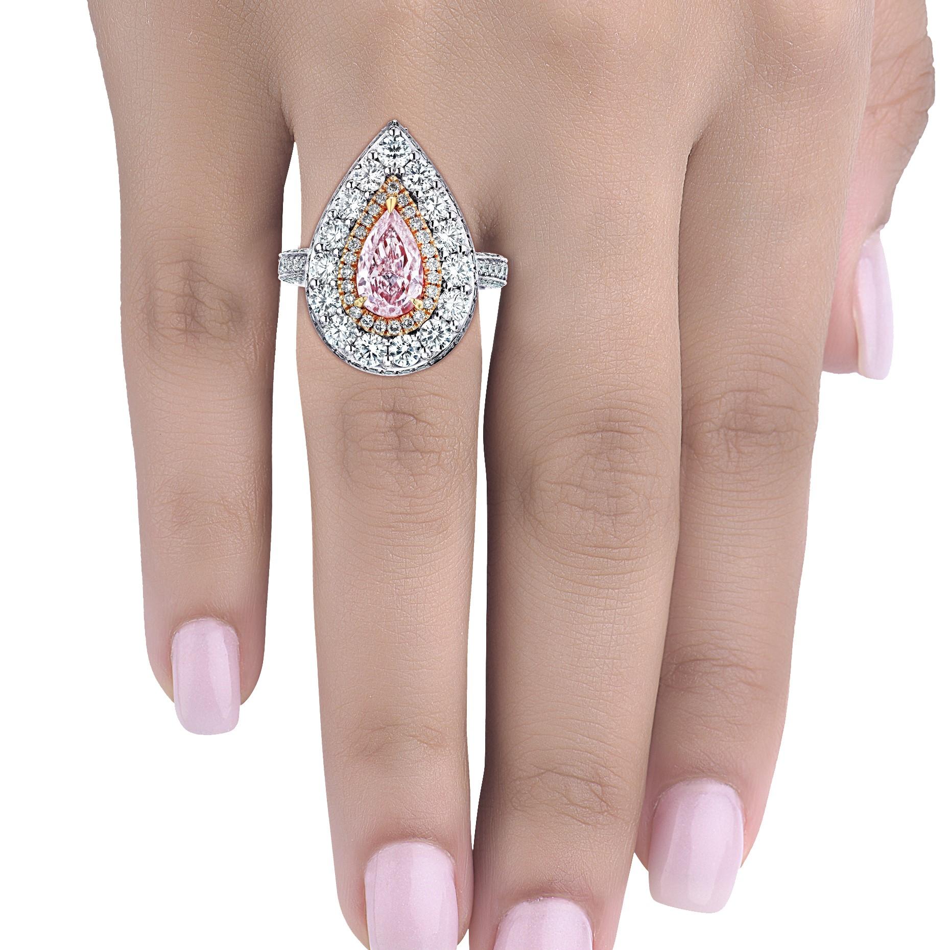 Manufactured in the one and only Emilio Jewelry factory this one and only Pink diamond ring is for the person who has everything, except this! Pink diamonds are the rarest of all the colors. The center diamond is a natural GIA certified 1.55 carat