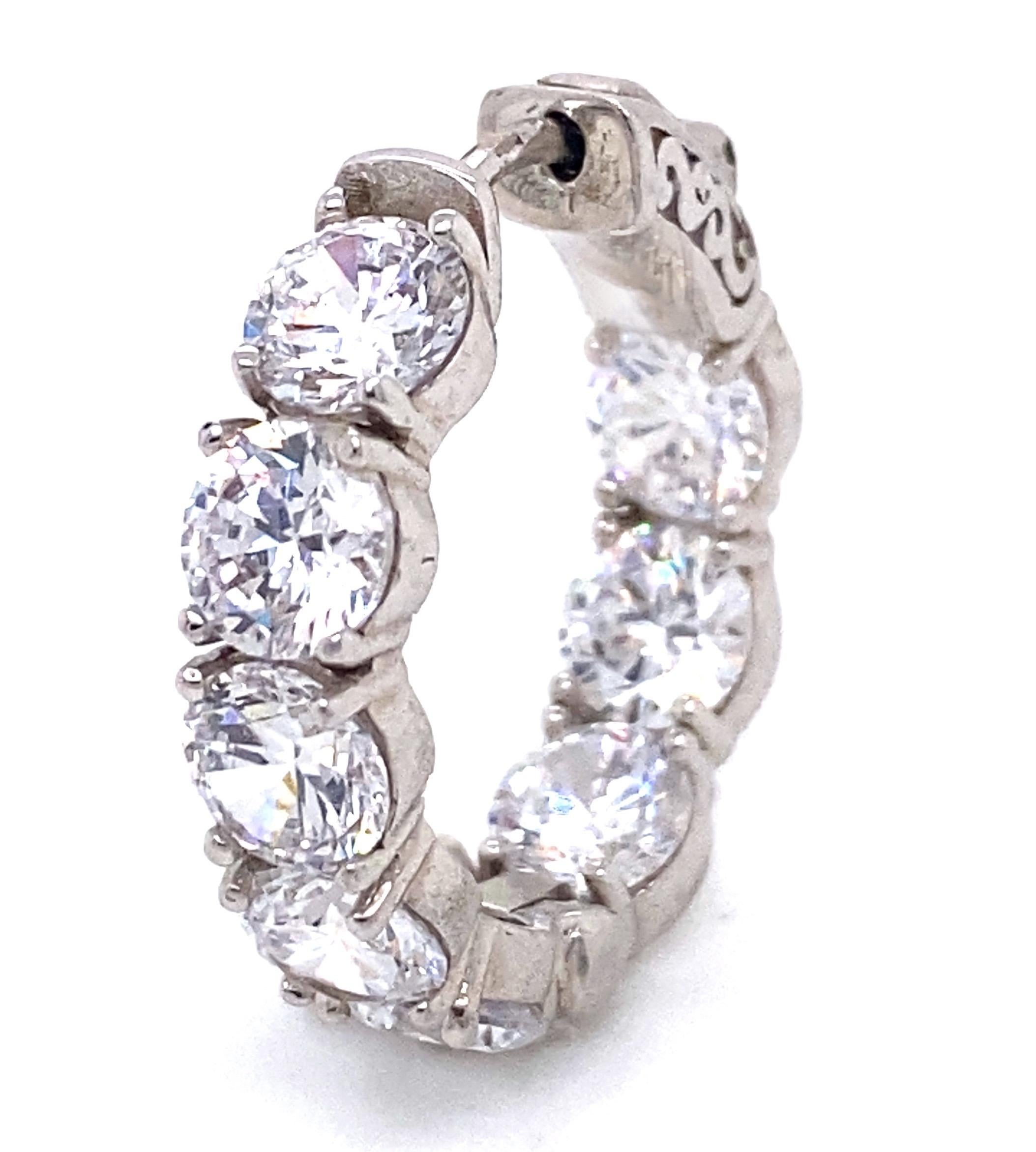 Created at the Emilio Jewelry atelier on New York's Fifth Avenue, we carry the most impressive inventory of diamonds hoops in the jewelry industry. 
Size of each diamond: approximately .50ct outside and .40ct inside
Approximate total weight: 6.90