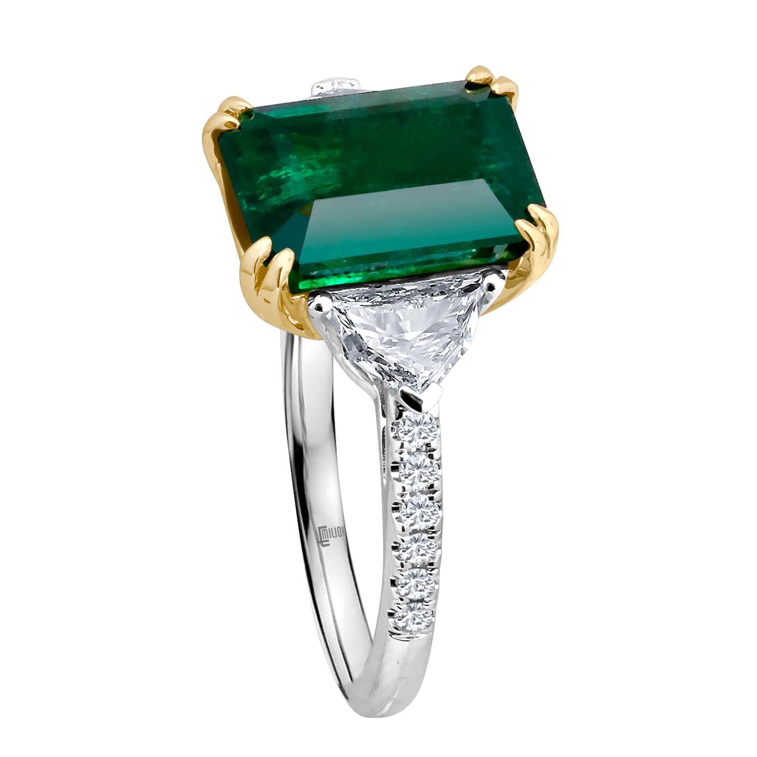 Hand made in the Emilio Jewelry Factory, A gorgeous deep green Certified Emerald cut Zambian Genuine Emerald 4.50 Carats set in the center. The emerald is very clean and completely eye clean. The emerald is noted on the certificate as an Intense