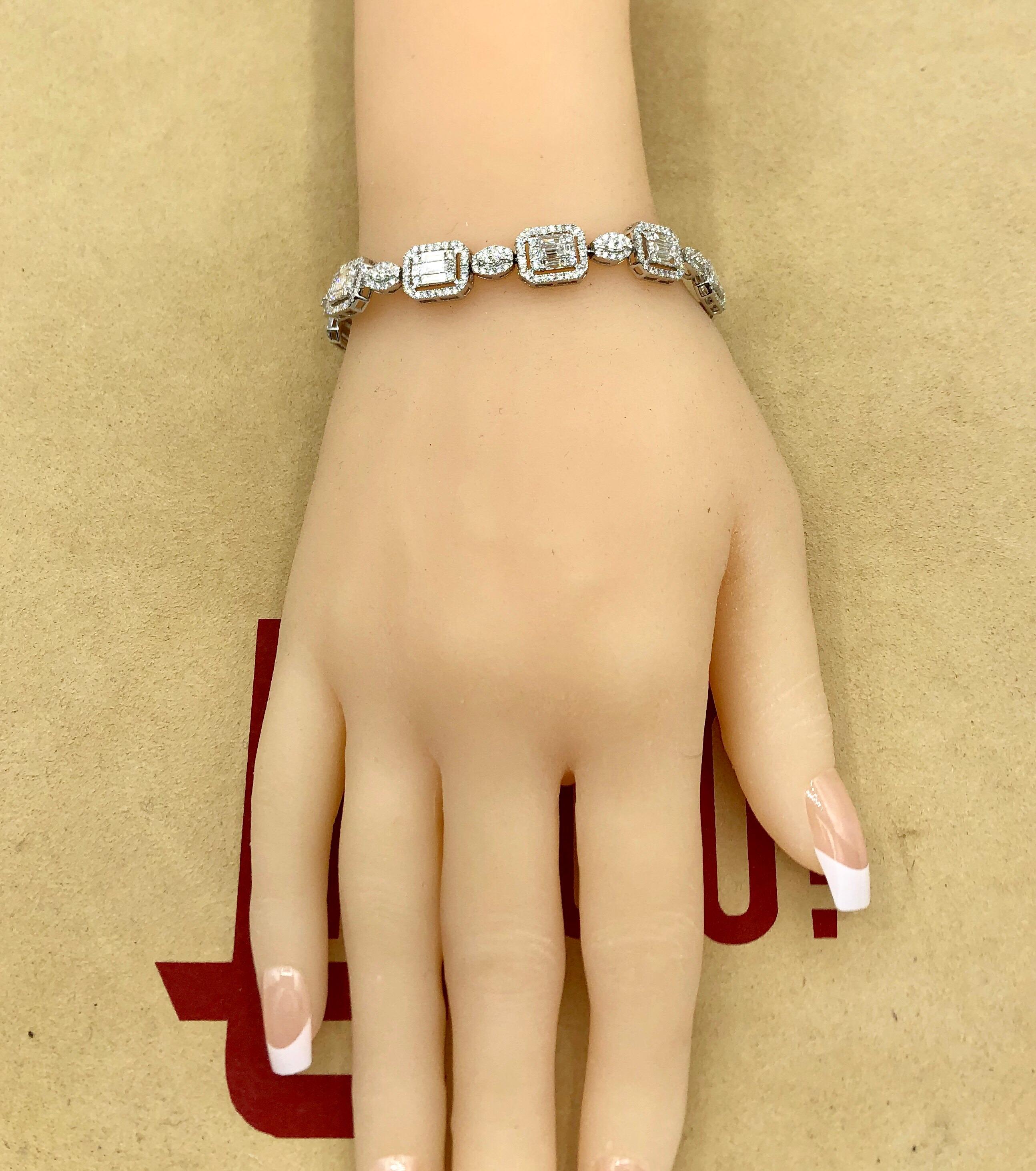 Hand made in the Emilio Jewelry Factory. Here are the details
Metal: 18k
Natural Diamonds: 6.07 mixed shapes including princess cut, round, and baguette diamonds to create an illusion of large single stones. 
Color/Clarity: E color Vvs1 clarity