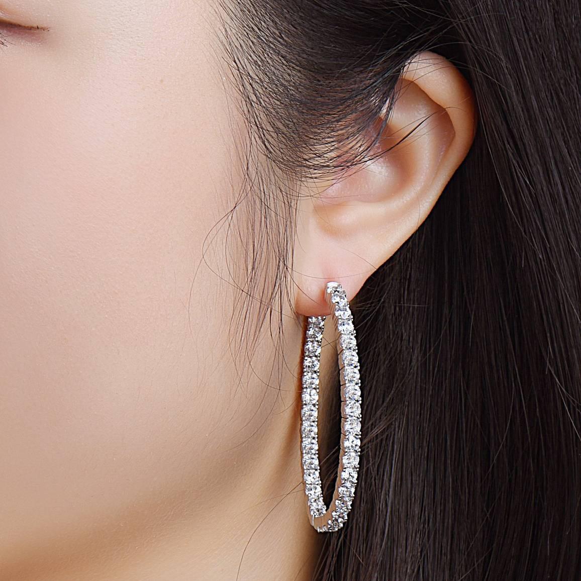 Hand made in the Emilio Jewelry Atelier, Also known as the king of diamond hoops, this Oval shaped inside out diamond hoop earrings set with round diamonds.Our  push locking mechanism is to ensure you never lose this precious earring! 
Approx total