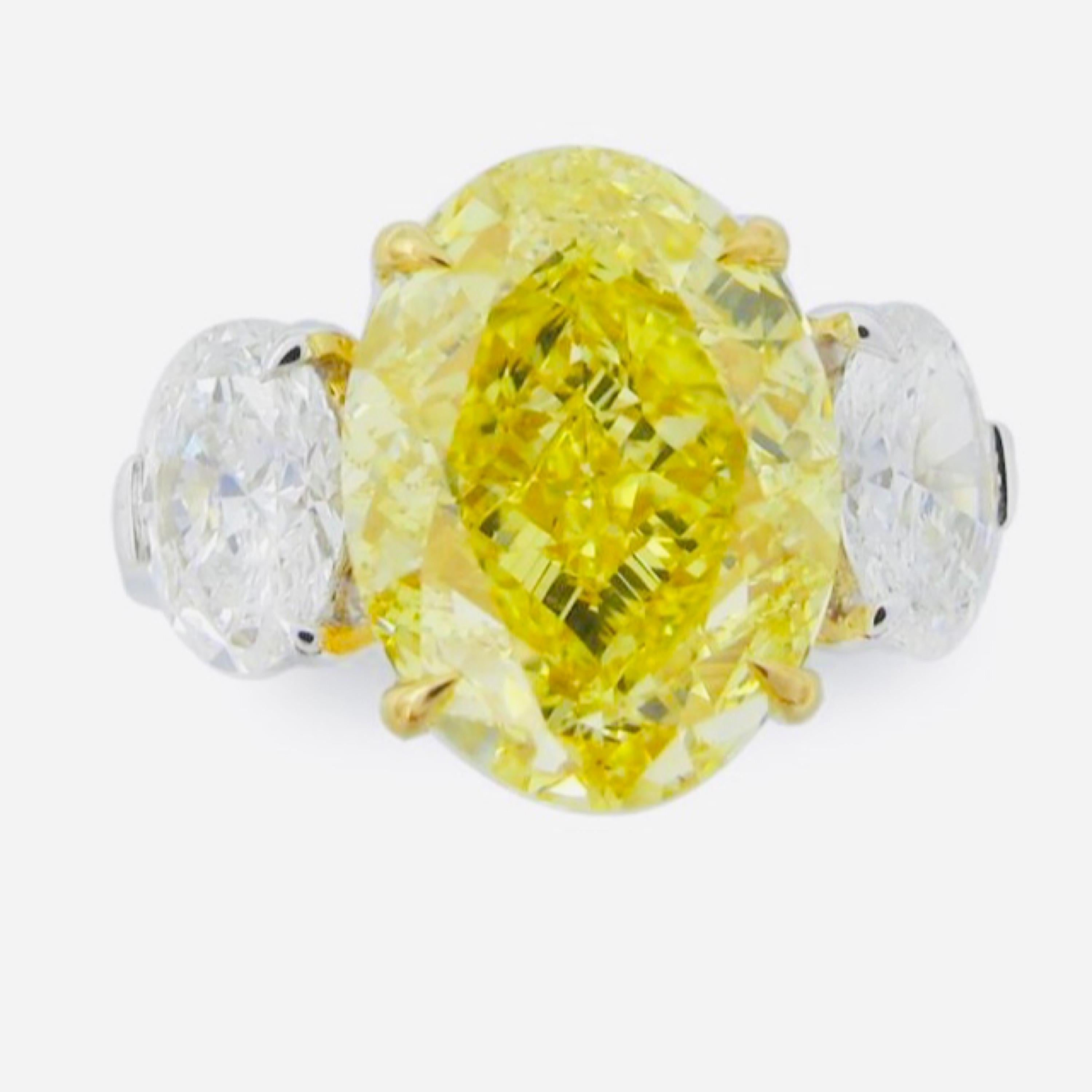 From The Museum Vault At Emilio Jewelry New York,
The most spectacular Vivid yellow diamond ring that exists! Filled with tremendous fire, sparkle and dance the center diamond is a dream for whoever will own it. The center is just over 6.50ct and