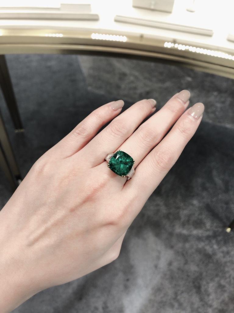 Showcasing a very special certified 8ct old mine Muzo Colombian emerald center stone of excellent color, clarity and saturation. Hand made in the Emilio Jewelry Atelier, whom specializes in rare collectible pieces in the fine emerald sector. 
Please