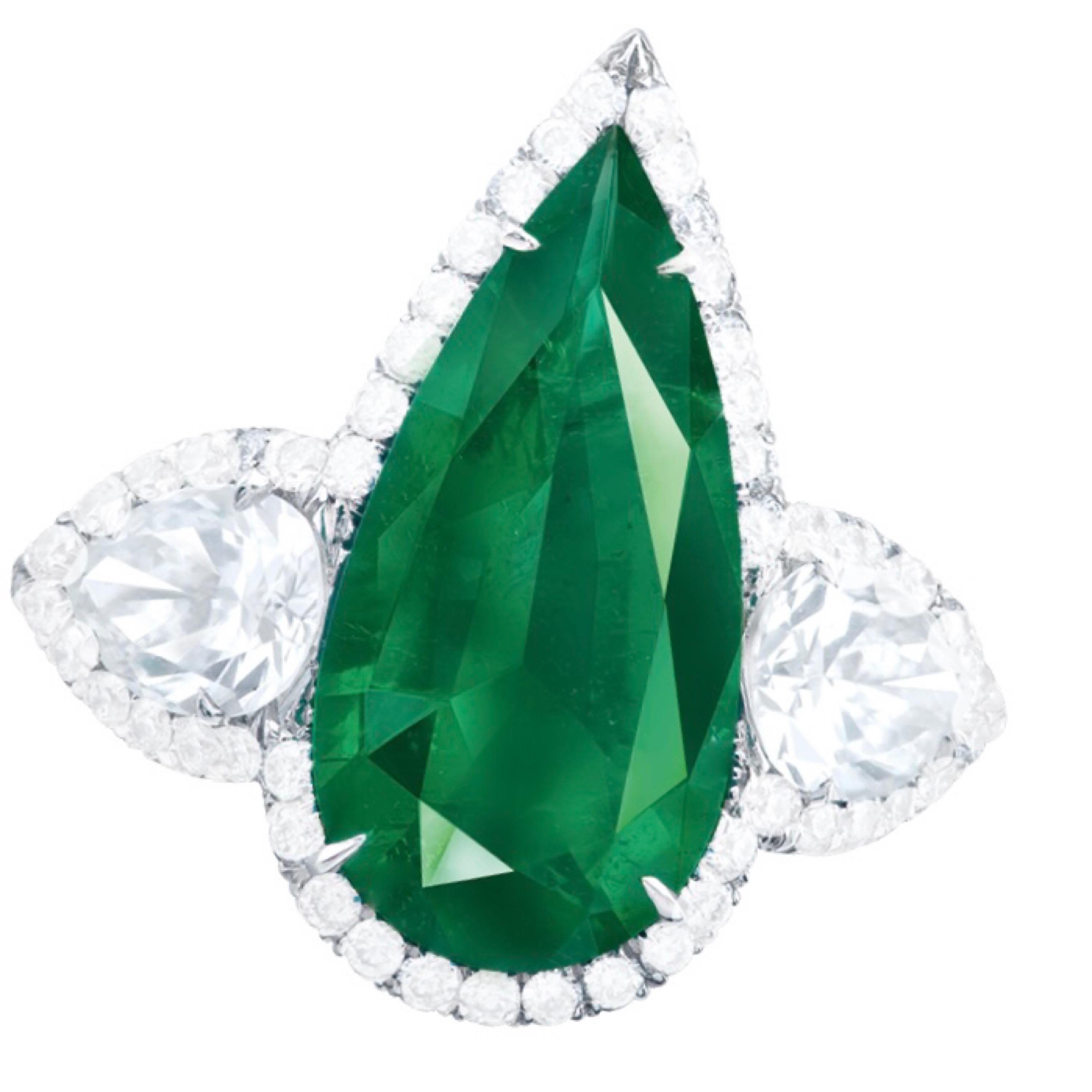 From the Emilio Jewelry Museum Vault, Showcasing a magnificent investment grade center pear shape emerald weighing 2.60 carats. The emerald is certified by AGL as a Colombian untreated No Oil natural stone. 
We are experts at creating jewels for