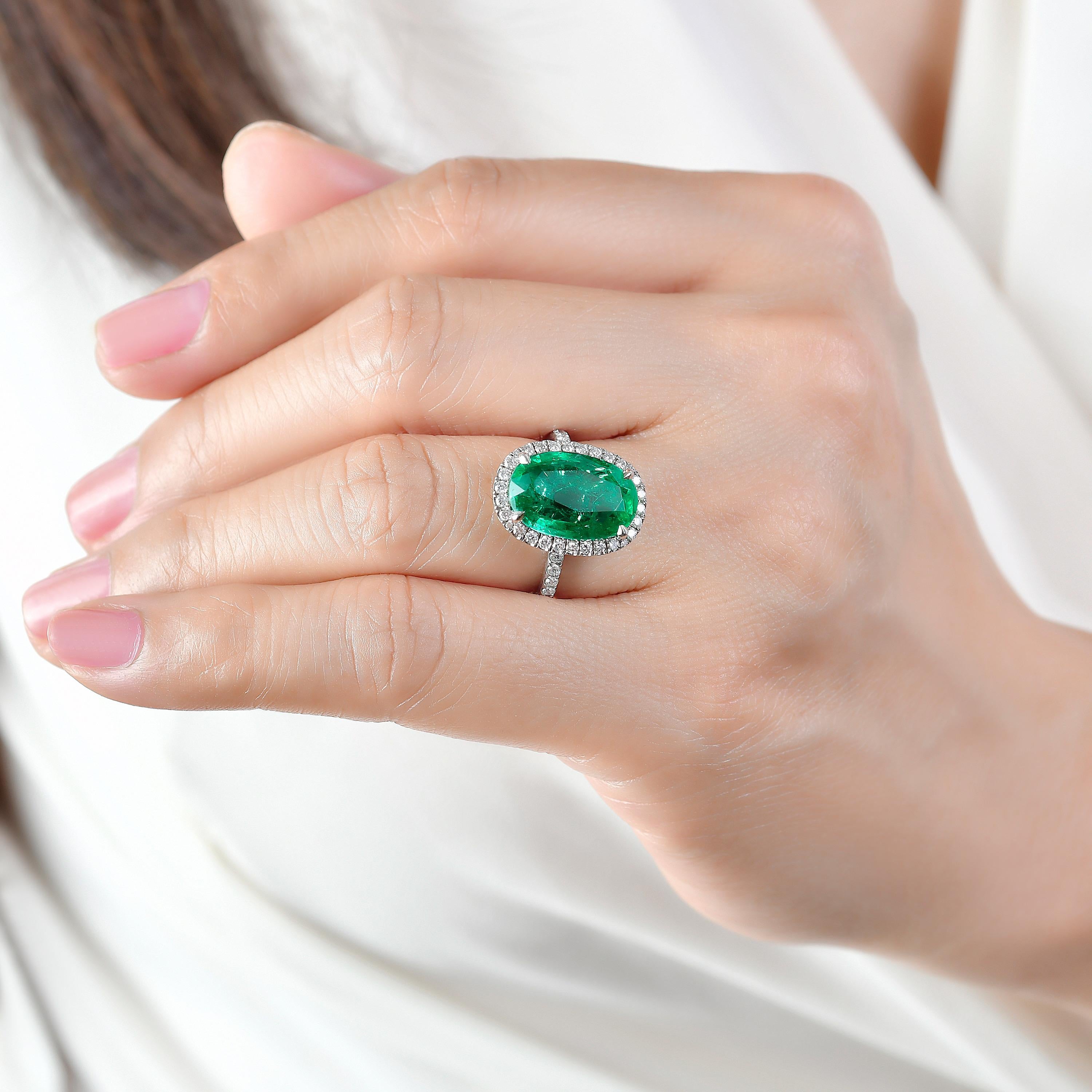 From Emilio Jewelry, a well known and respected wholesaler/dealer located on New York’s iconic Fifth Avenue, 
Featuring a spectacular and extremely unique shape elongated cushion cut emerald, with an astonishing ratio. The color is vivid green and