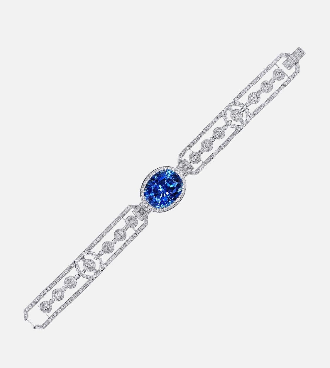 From the Museum Vault at Emilio Jewelry in New York,

A magnificent untreated natural vivid blue sapphire sits in the center of this bracelet. Please inquire for more information or additional images. 