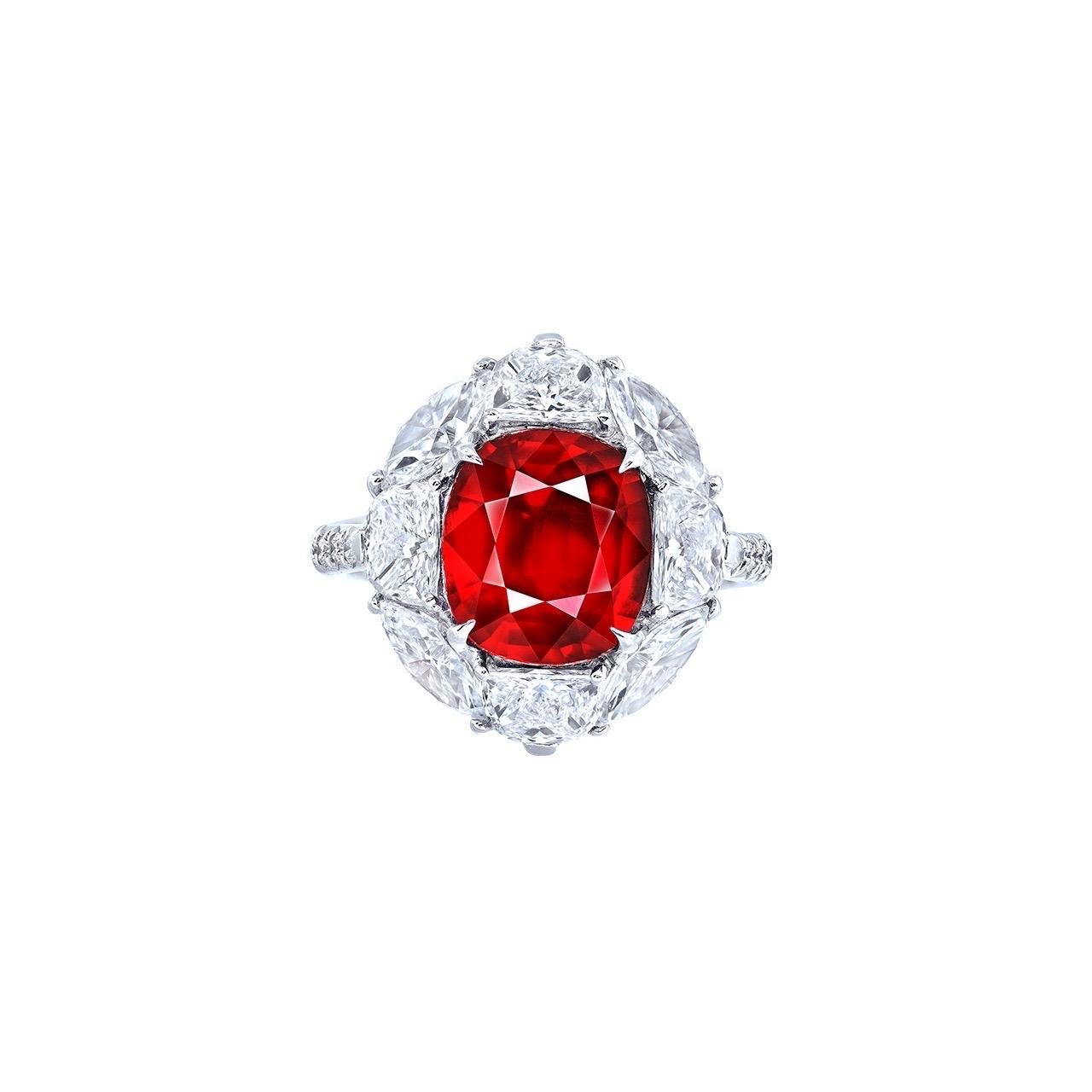 From the Museum Vault At Emilio Jewelry New York,
Center Stone: Grs certified as pigeons blood no heat mozambique origin, over 5.00 carat Vivid to Deep Red (PIGEON BLOOD) CUSHION
Setting: 4 white diamonds totaling about 1.20 carats, 4 marquise cut