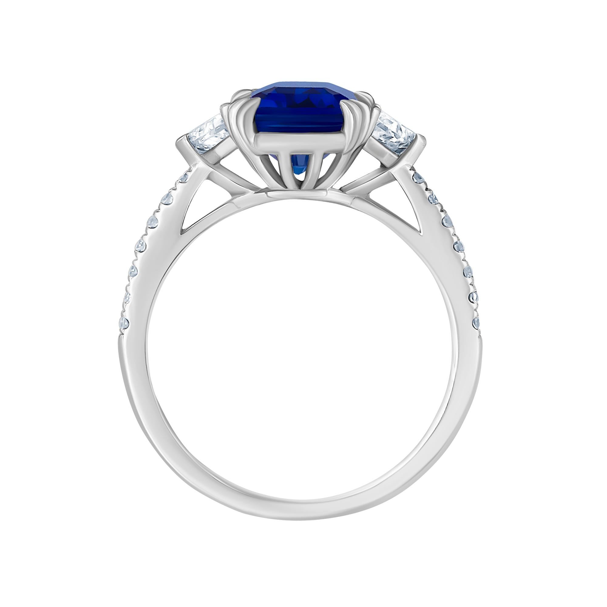 This beautiful Diamond Sapphire ring was crafted in luxurious Platinum. This ring is adorned with a cornflower blue Color; 4.34ct  Emerald Cut ceylon Sapphire. Measuring 10.70x7.50 mm. The side diamonds are Epaulette cut F color vvs2 clarity and