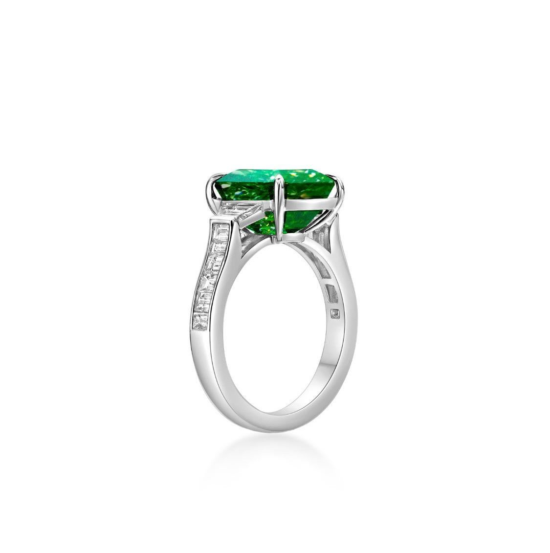 From Emilio Jewelry, a well known and respected wholesaler/dealer located on New York’s iconic Fifth Avenue, 
The center Emerald alone weighs just under 5.00 Carats, and is one of the finest Emeralds around! 
Color: Vivid Green 
Clarity: No