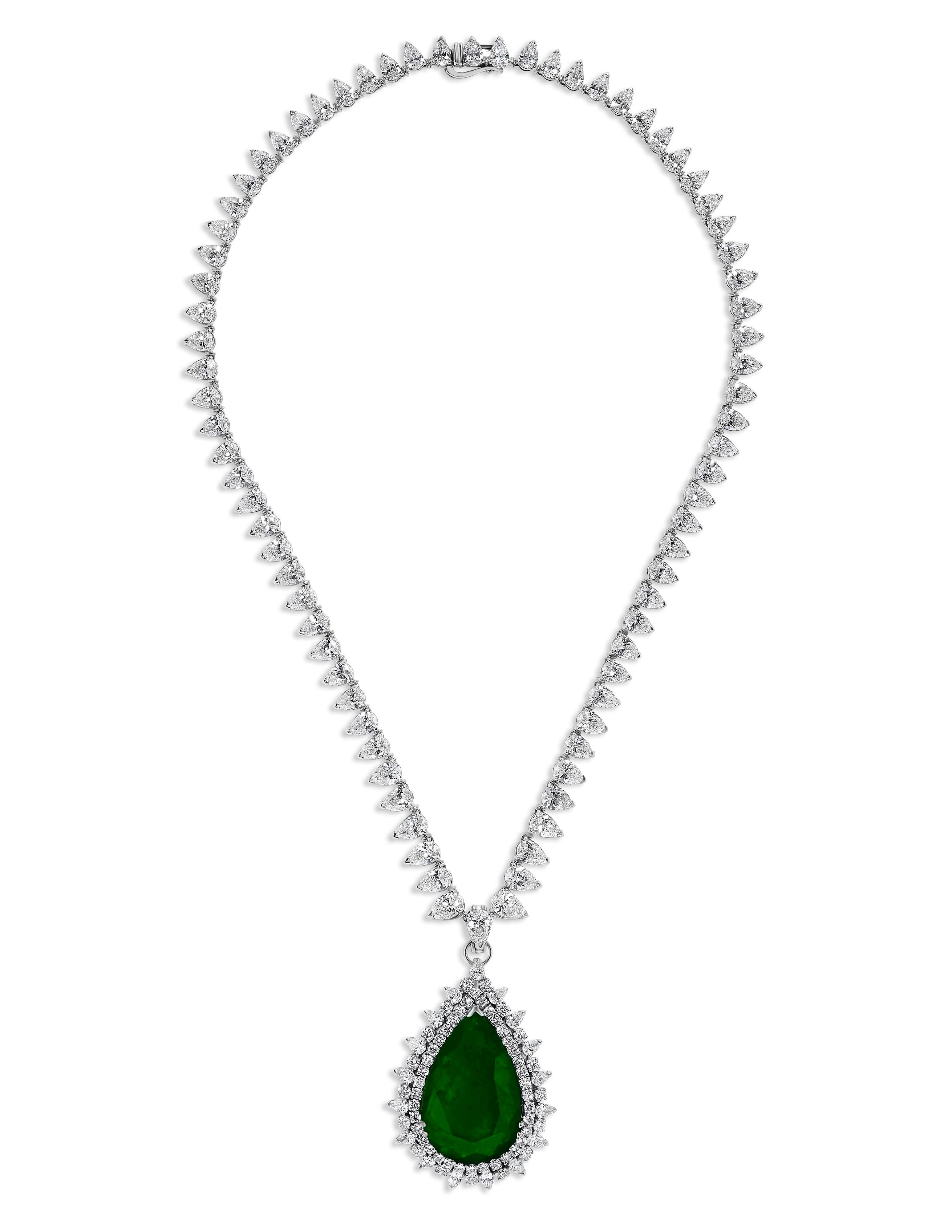 From the Museum Vault At Emilio Jewelry Vault in New York, 
Set in 18k gold featuring a certified Colombian vivid green center 24.53cts vivid green in color. 
Featuring another 38.35 carats of white diamonds E-F color, vvs1-vs2 clarity. 
Please