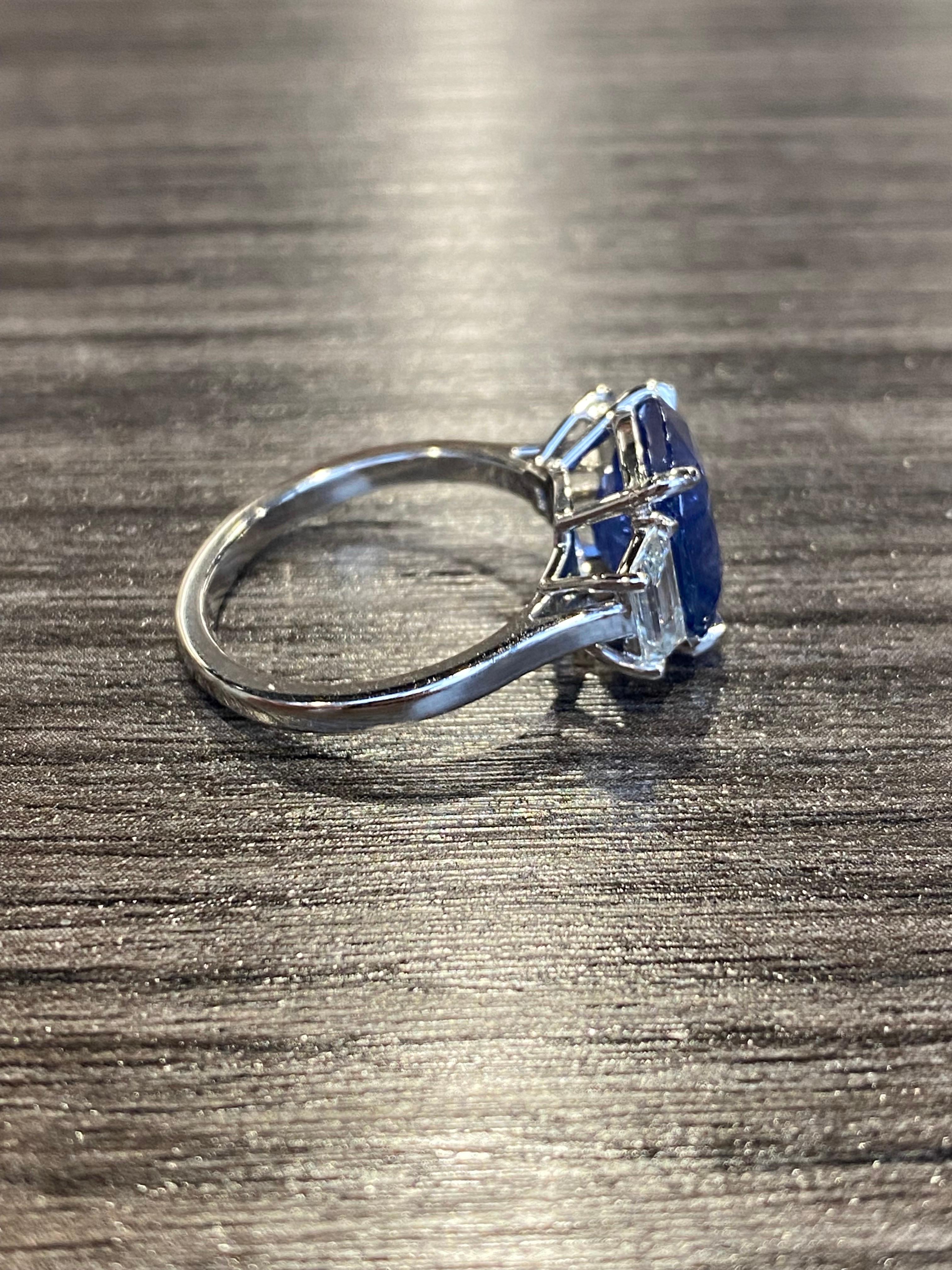 From Emilio Jewelry, a well known and respected wholesaler/dealer located in the Iconic Gem Tower/Gia Building in New York's Diamond District.
Total weight listed in title. 
The center sapphire is a drop dead gorgeous 5.56ct cornflower to vivid blue