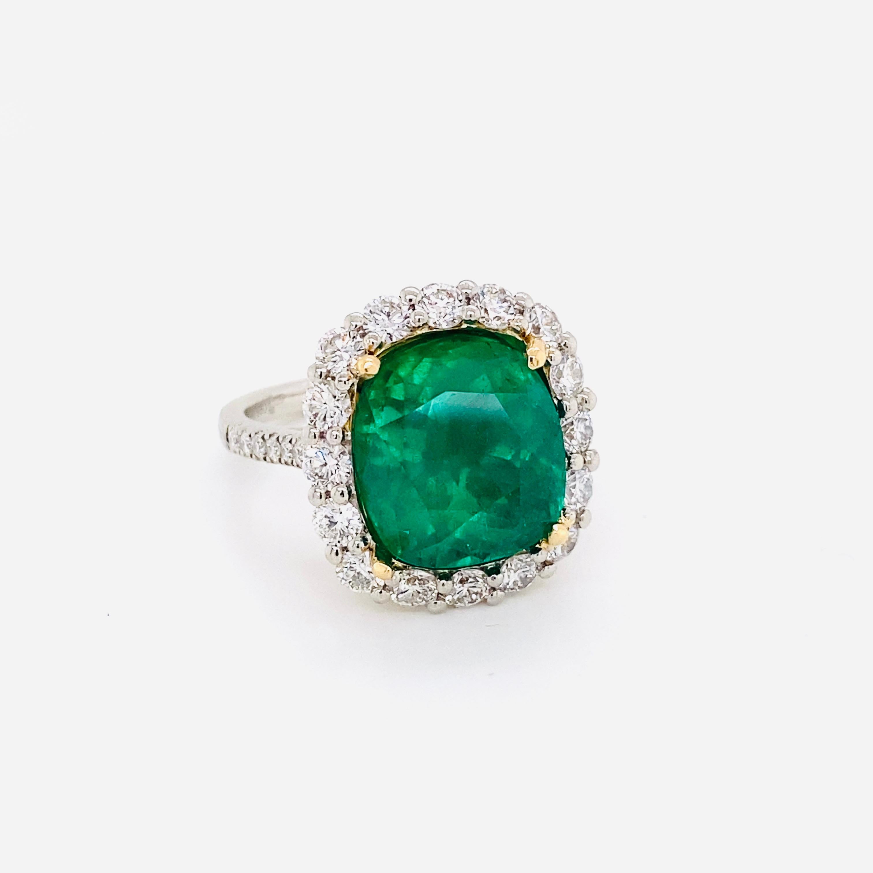 From the Emilio Jewelry  Vault, Showcasing a magnificent 7.65 carat natural Emerald certified by C.Dunaigre as a natural Colombian Emerald with minor oil treatment. The color is certified as Vivid Green the most desirable color in Emeralds. 
You