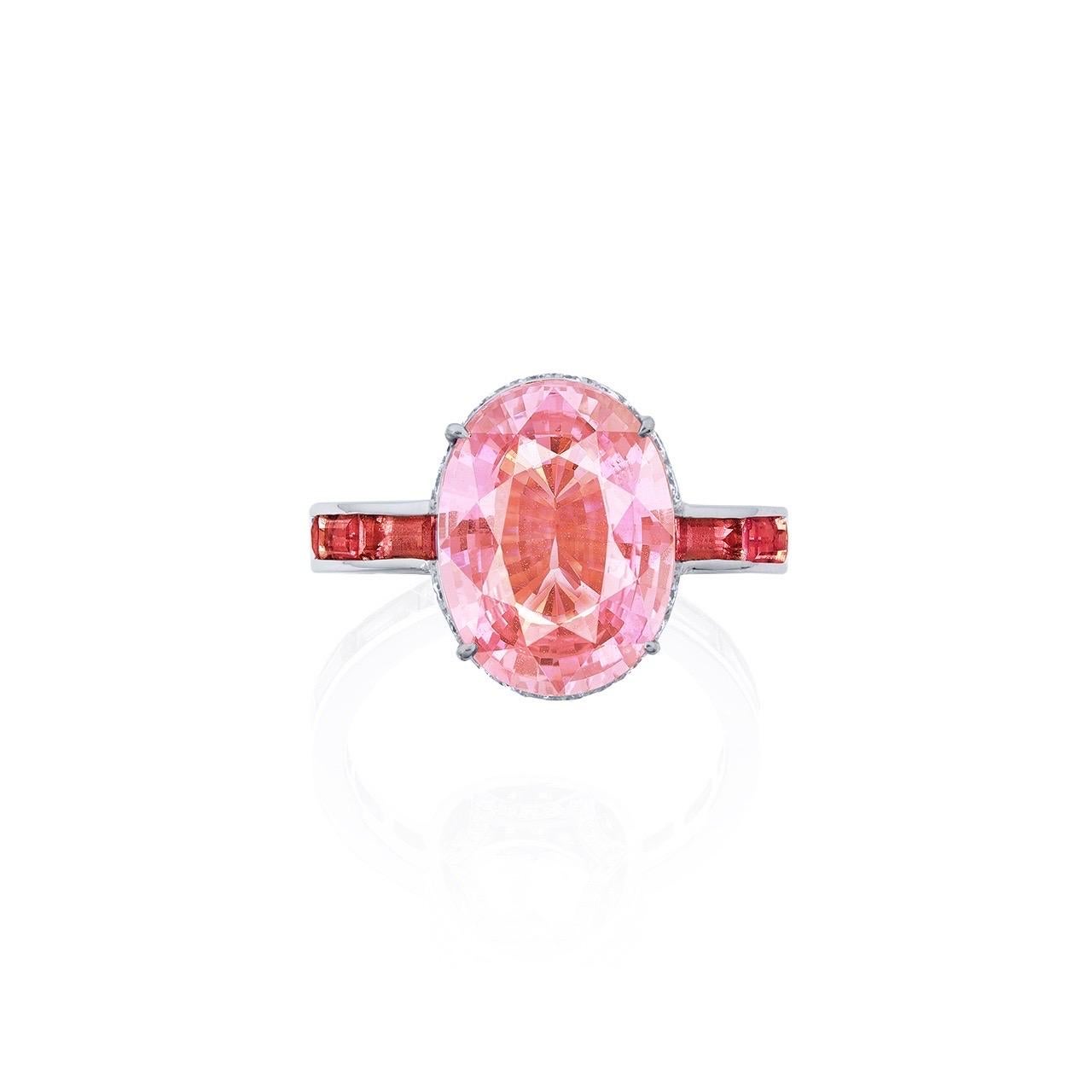 Main stone: 5.38 carat Orangy-Pink, Oval
Lot information
Setting: 14 Malayan color-change garnets totaling approximately 1.974 carats, 86 white diamonds totaling approximately 0.83 carats

From Emilio Jewelry, a well known and respected