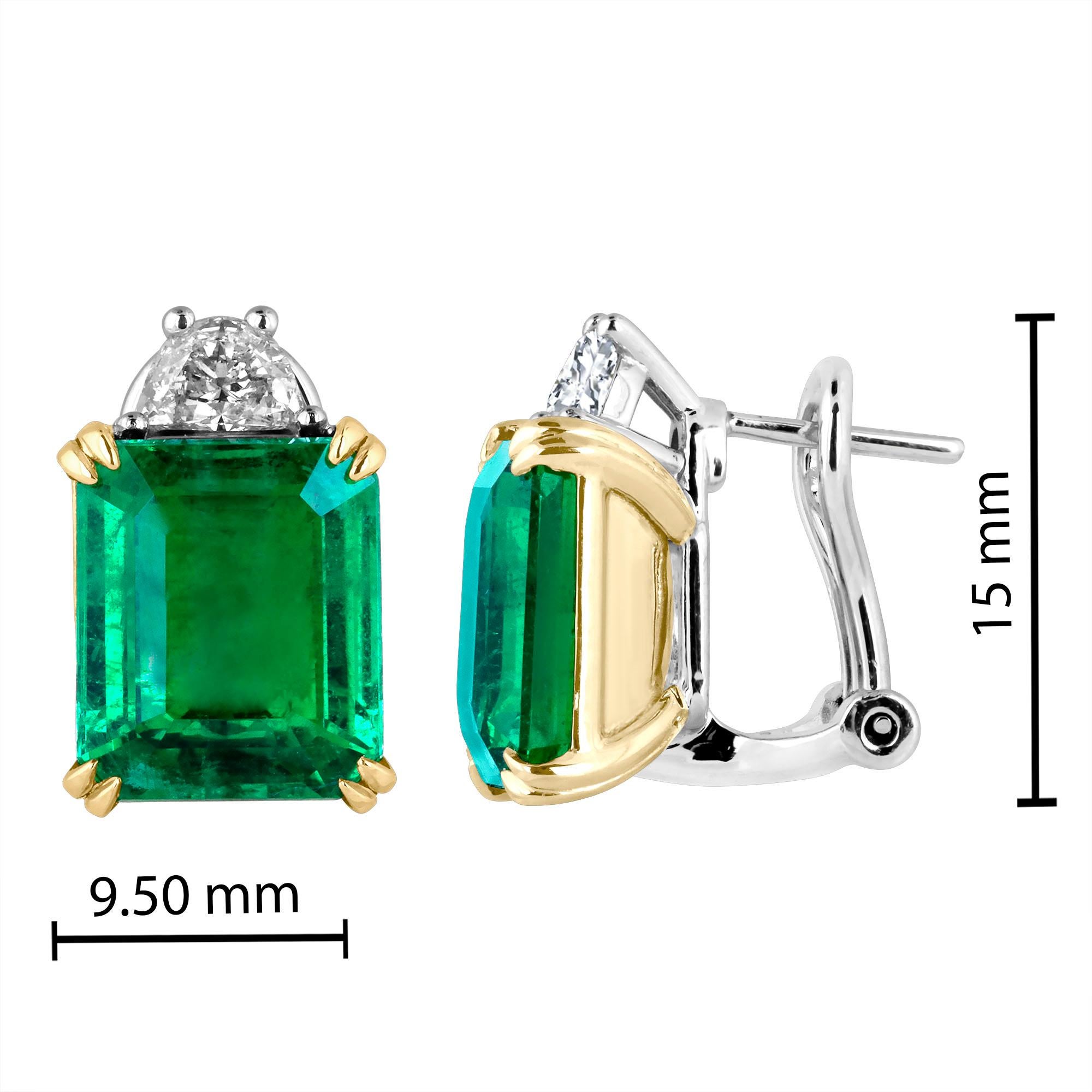 Hand made in the Emilio Jewelry Factory, 2 gorgeous bright rich emerald cut Zambian Emeralds wh 9.07 Carats set in the center. The emeralds are exteremely clean and completely eye clean. 
Center Emerald Dimensions: 11.30mm long X 9.50mm wide 
The