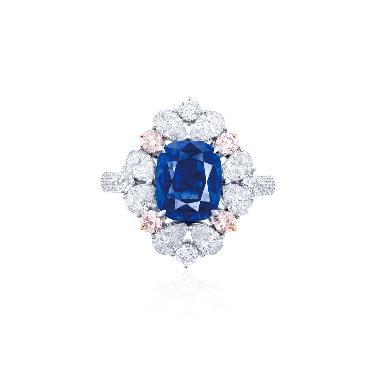 Kashmir Sapphire Main stone: 4.90+ carat Royal Blue, Cushion

Setting: 4 Argyle pink diamonds totaling approximately 0.31 carats, 8 fancy-cut white diamonds totaling approximately 1.52 carats, 58 round white diamonds totaling approximately 0.48