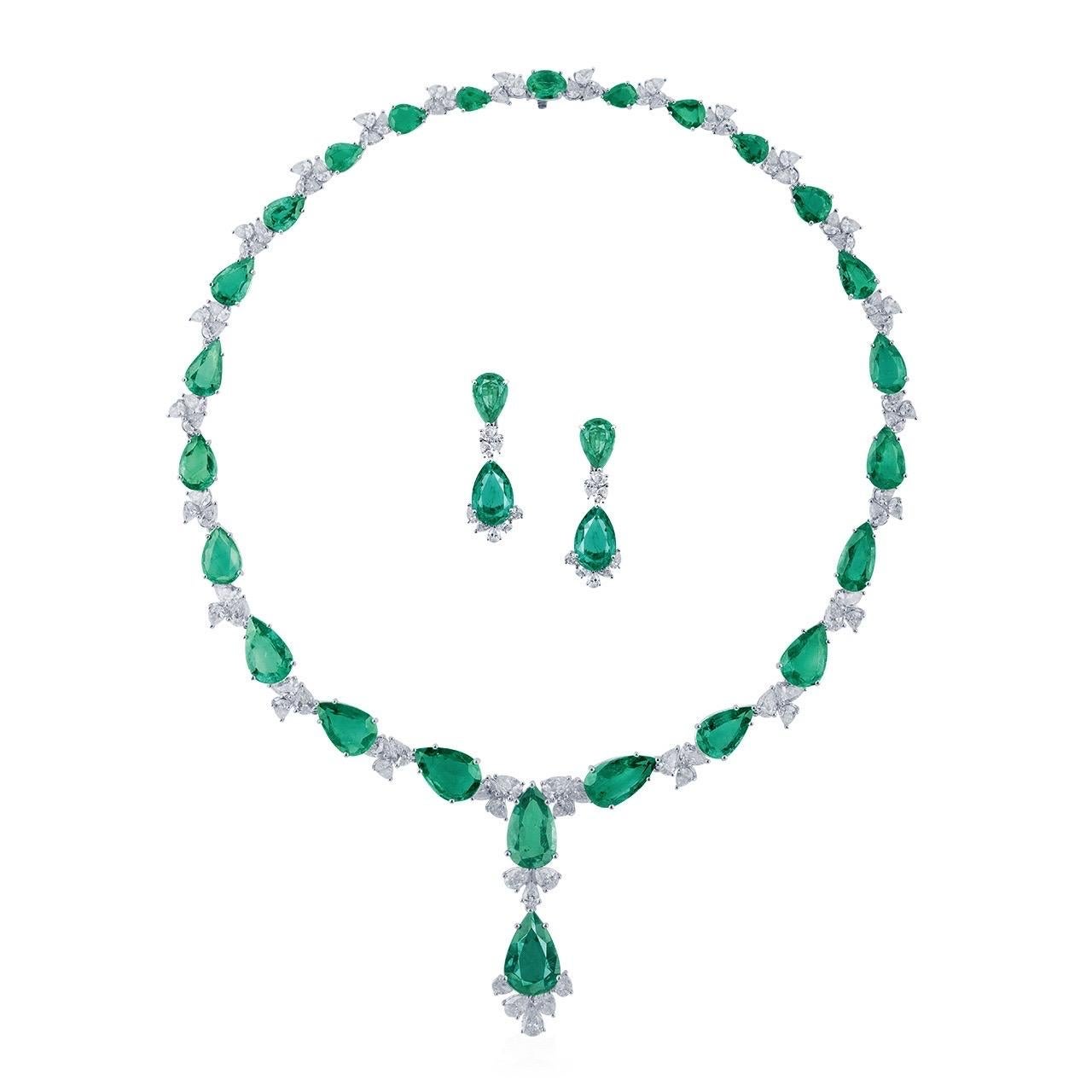 Featuring all natural untreated Zambian Emeralds. 
Main stone of the chain: 25 emeralds totaling approximately 65.07 carats
Main stone of earrings: 2 emeralds totaling approximately 15.40 carats, total finished product weight
setting: white diamonds