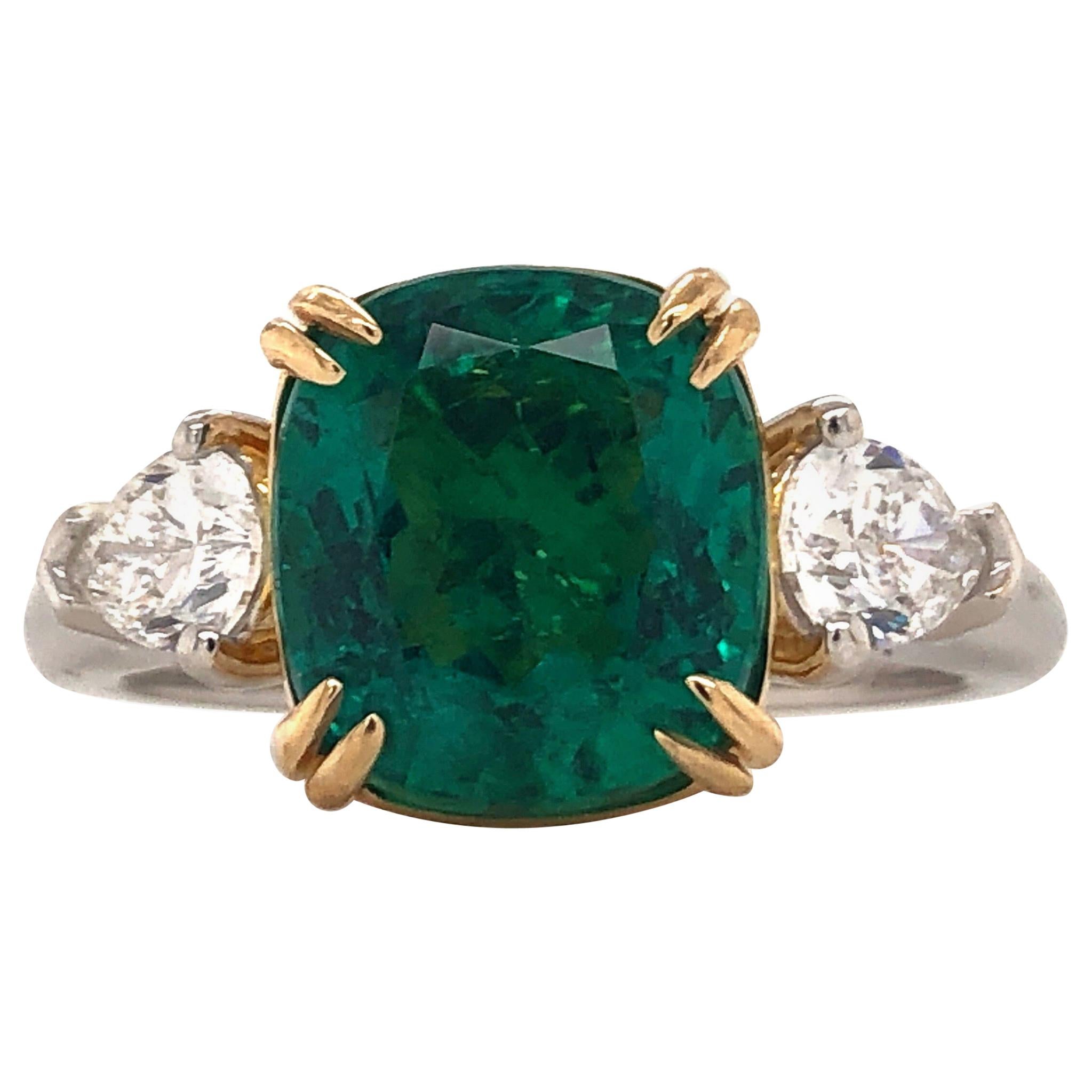 Created in the Emilio jewelry atelier. Showcasing a cushion shape 3.57ctct Genuine natural certified Emerald. This emerald is certified as no oil/untreated/no clarity enhancement which makes up for .001% of emeralds available in the market. No oil