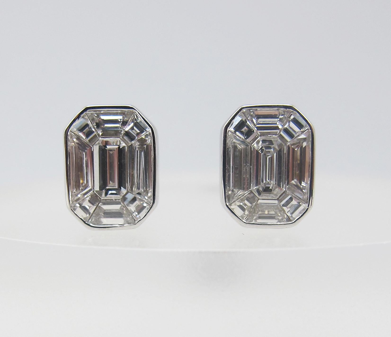 From the vault at Emilio Jewelry New York,
a diamond stud earring where all the emerald cuts blend as one creating an illusion diamond stud visual of a gigantic single diamond on each ear! 18 Pieces Pie Cut Emerald Shape D-G Color VVS-VS Clarity