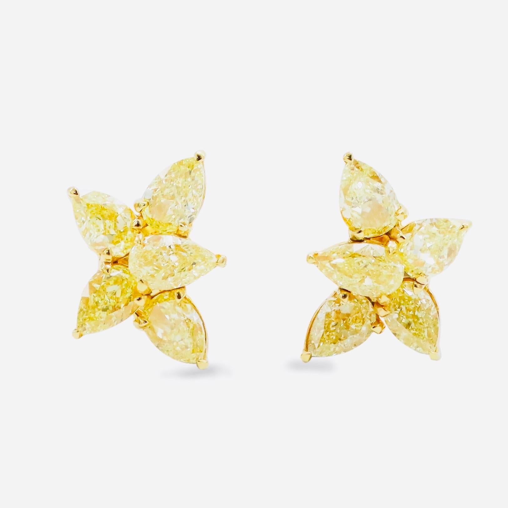From the vault at Emilio Jewelry located on New York's iconic Fifth Avenue,
Featuring a collection of half carat each natural fancy intense yellow diamonds set in this simple elegant earring that can be worn dressed up, or casually everyday! Clip on