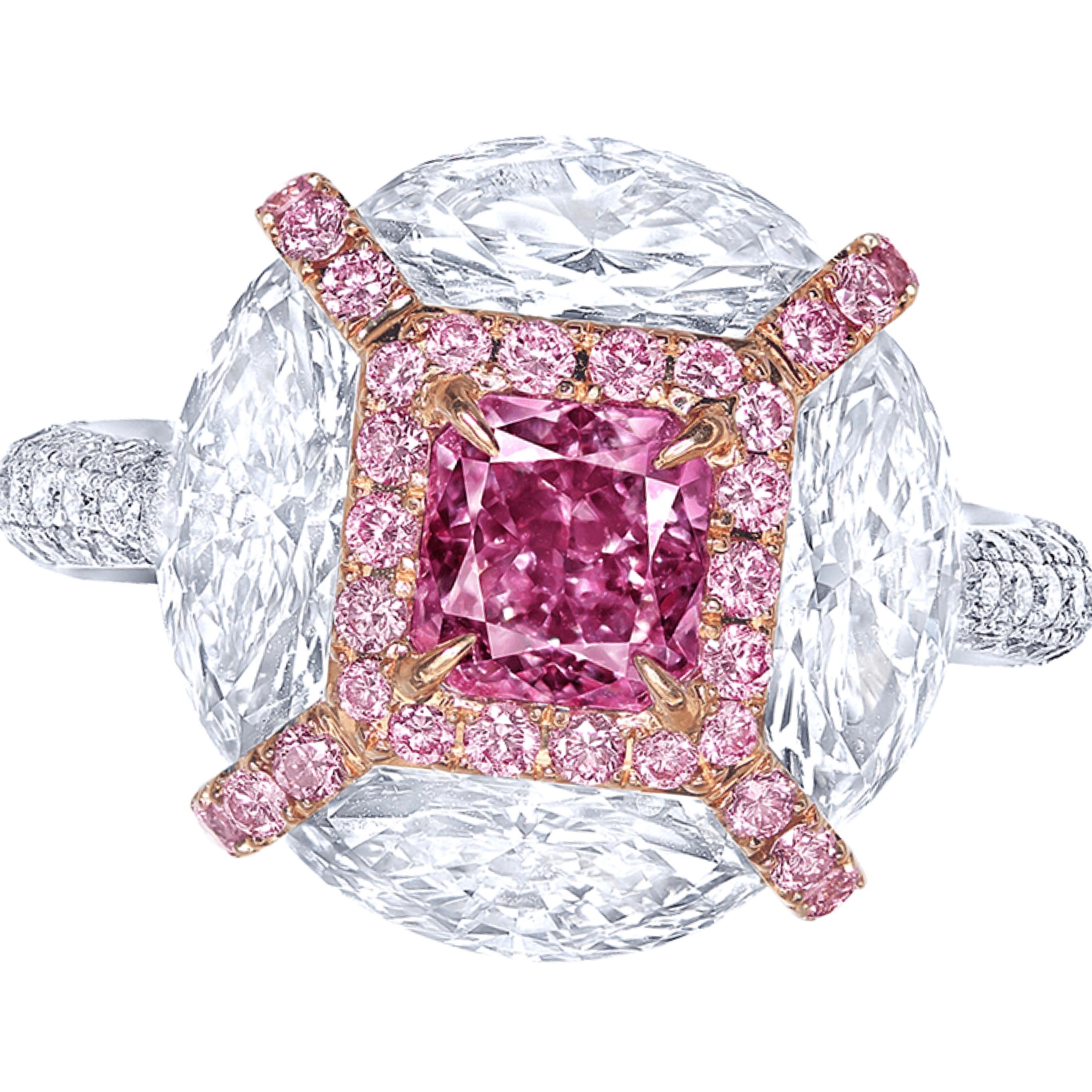 From the museum vault at Emilio Jewelry in New York. 
Main stone: Gia certified 1.00 carat natural Fancy Intense Pink-Purple 
Setting: 4 fancy-cut white diamonds totaling approximately 2.40 carats, 34 pink diamonds totaling approximately 0.28