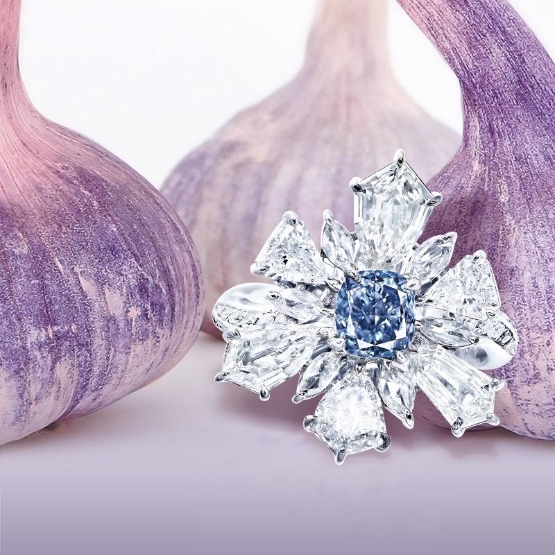 From The Museum Vault At Emilio Jewelry, a dealer located on New York's iconic 5th Avenue,
Center Stone: Featuring a Gia certified natural  1.00 carat + Fancy pure Blue diamond with no overtone. 
Setting: 16 white diamonds totaling about 0.09